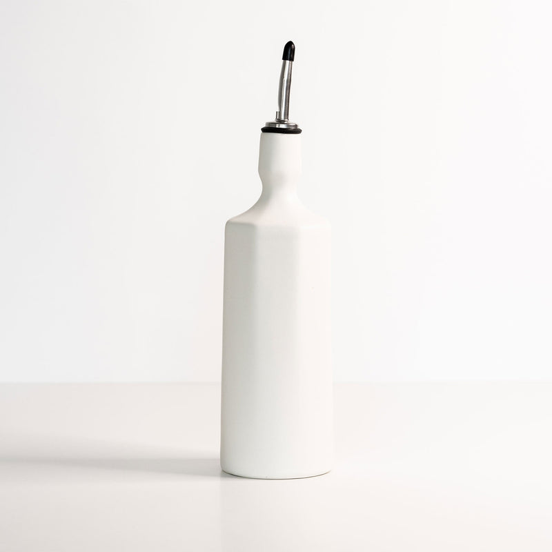 Porcelain olive oil dispensers in muted earth tones
