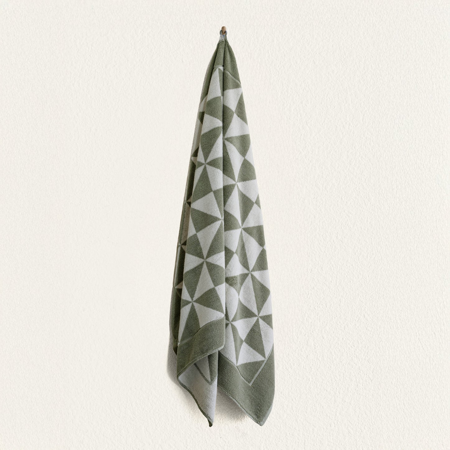 Lifestyle photo of Umbra towel hanging in bright modern bathroom