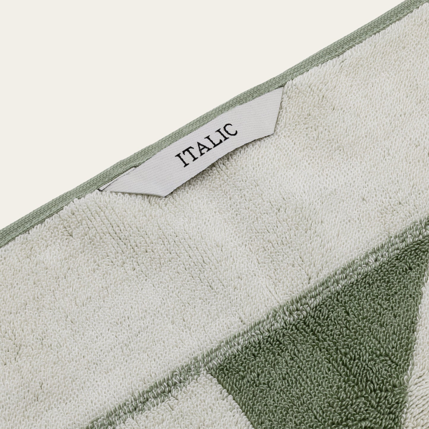 Umbra cotton towel styled on countertop with neutral bathroom decor