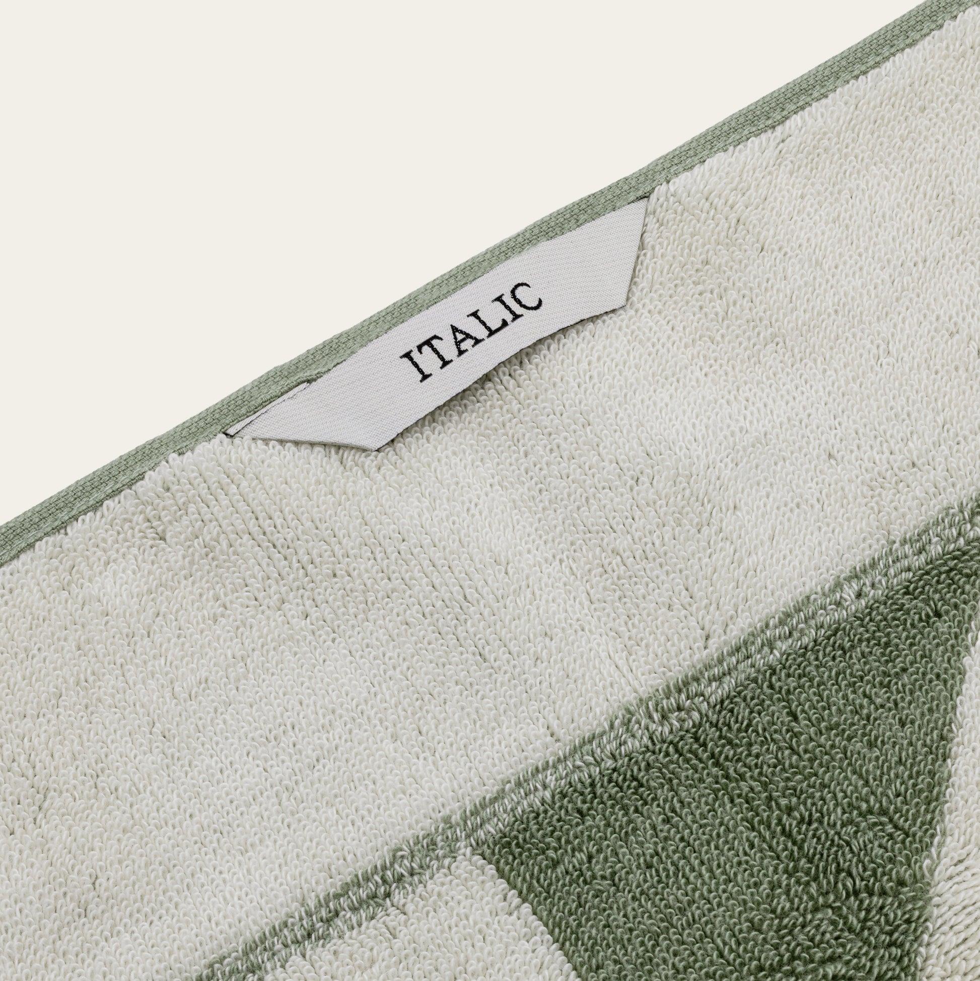 Umbra cotton towel styled on countertop with neutral bathroom decor