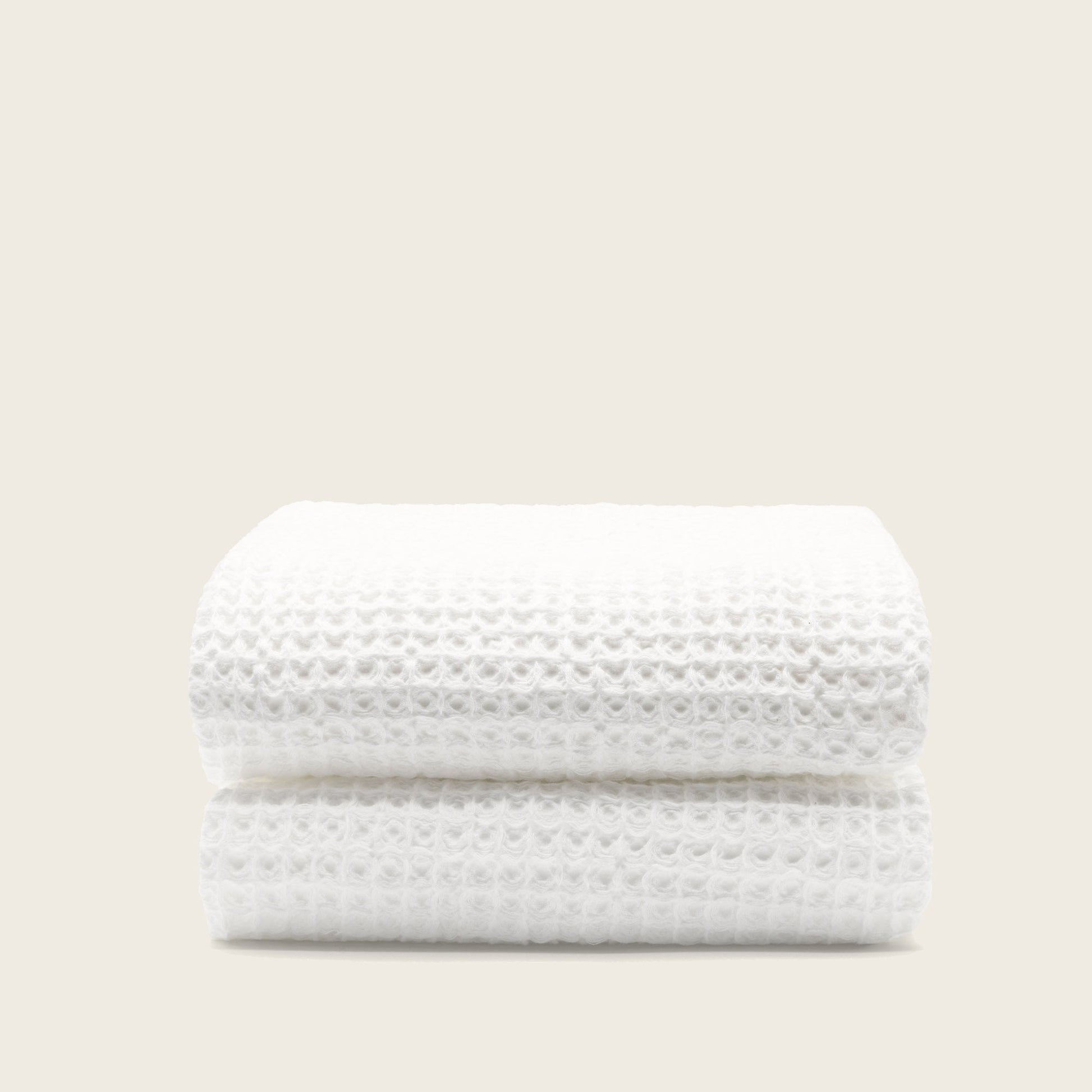 Sedona waffle hand towels stacked neatly on stone vanity countertop