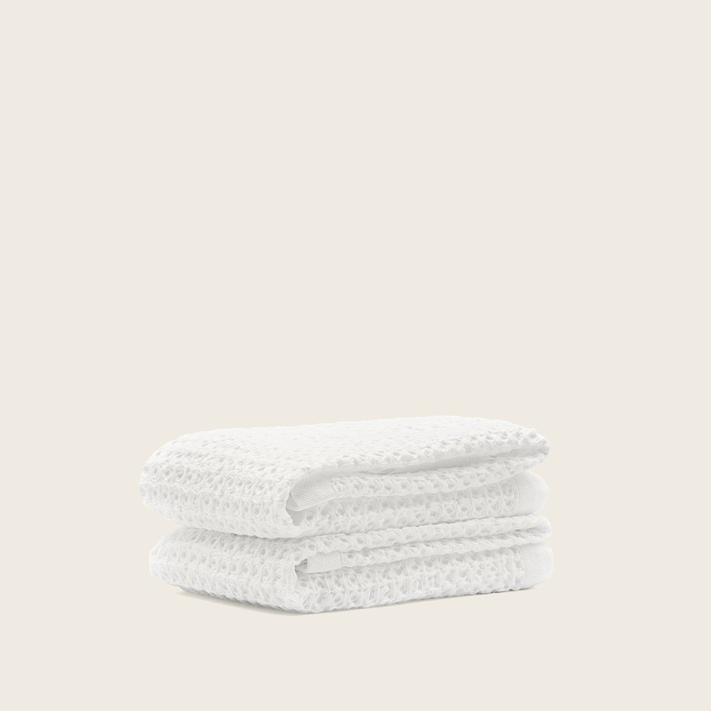 Sedona waffle towel hanging beside walk-in shower in bright bathroom