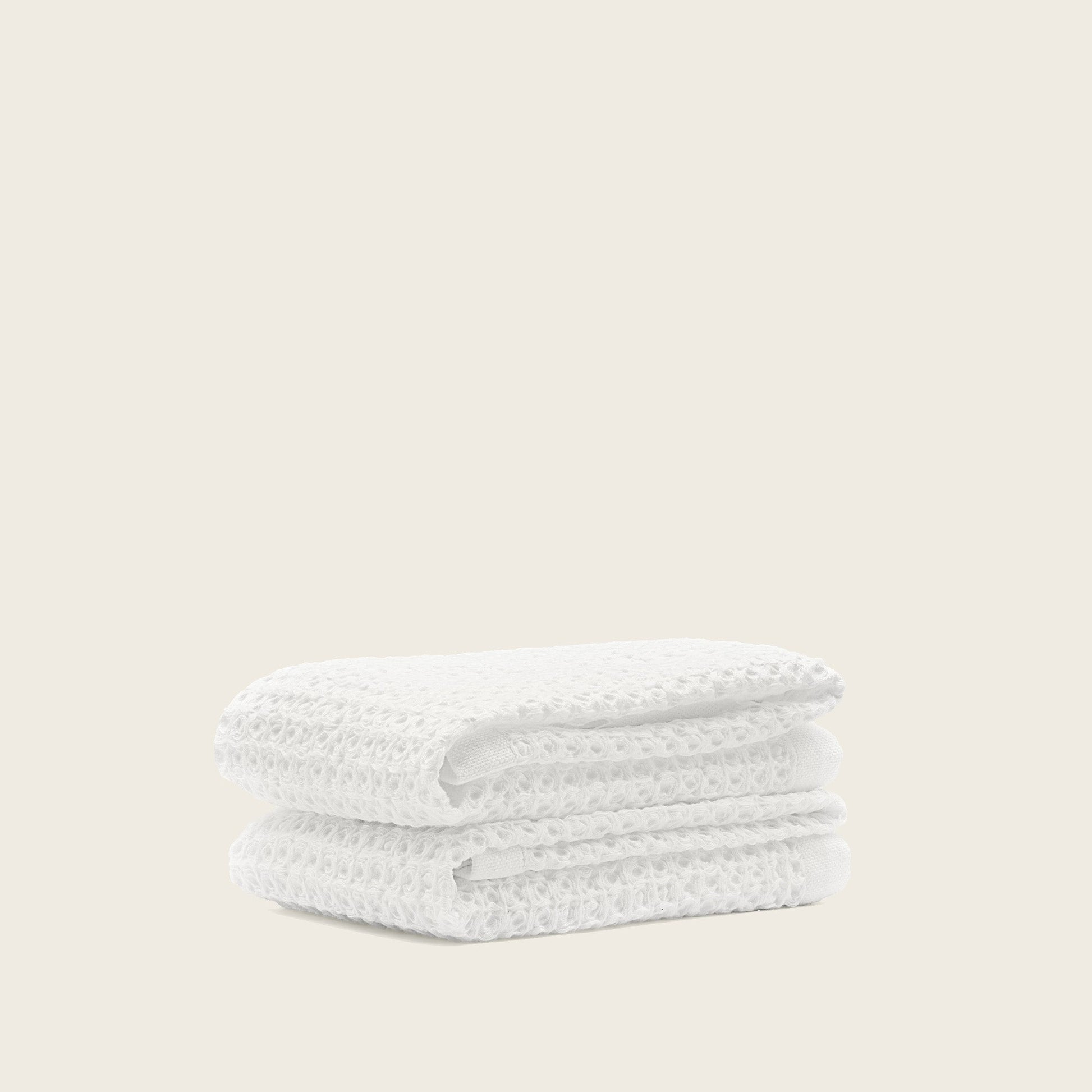 Sedona waffle towel hanging beside walk-in shower in bright bathroom