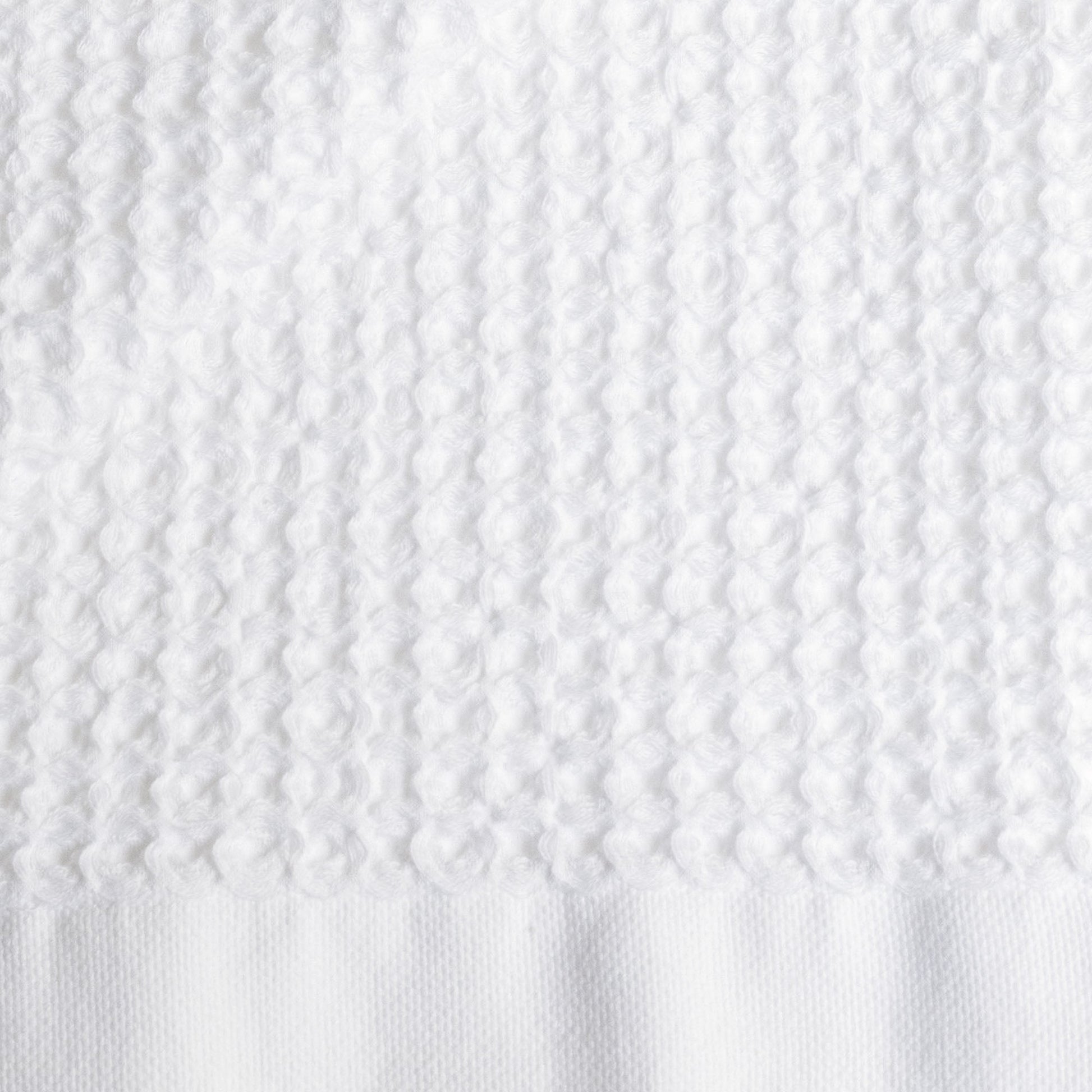 Sedona waffle towel draped on chair showing relaxed cotton drape