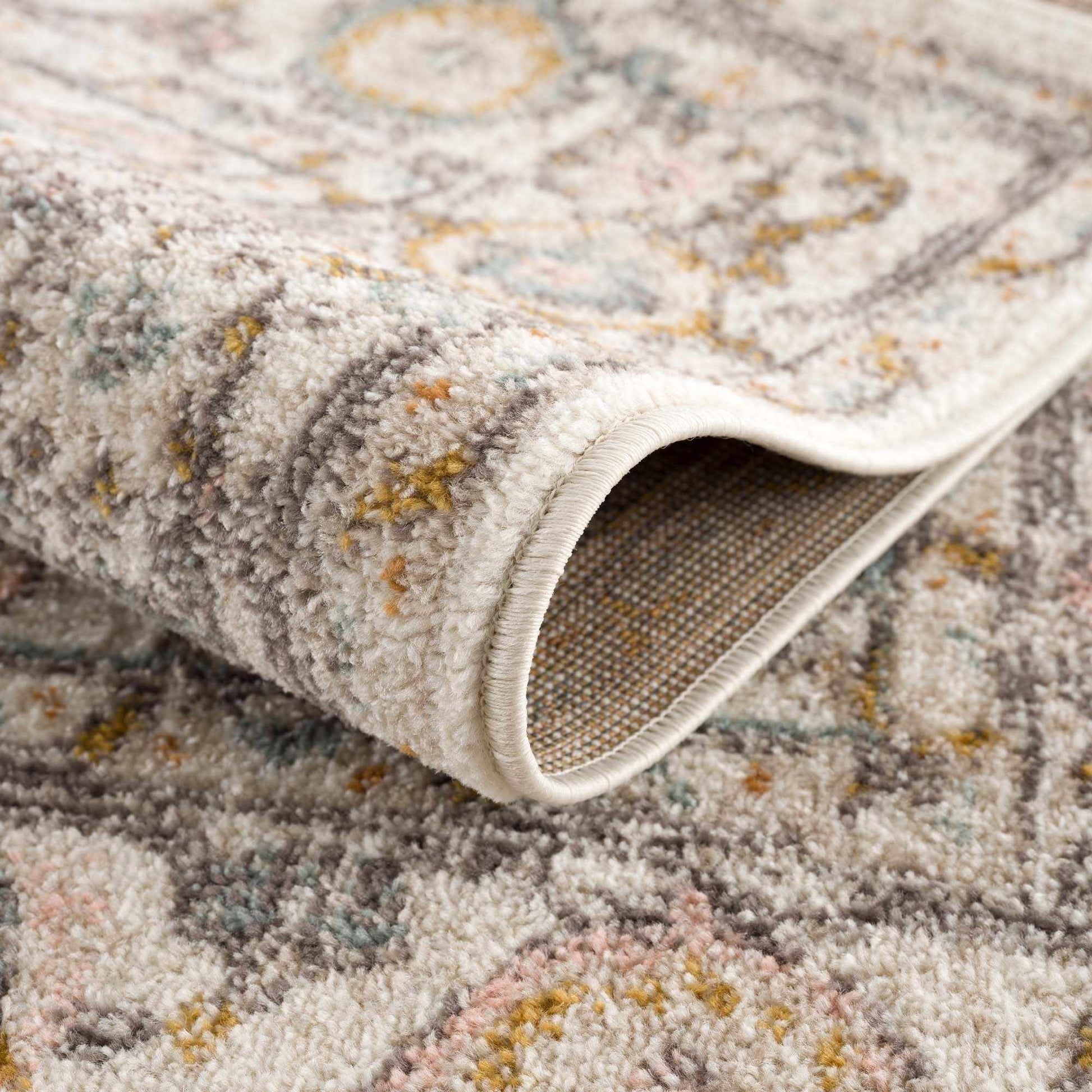 Herstmonceux rug pattern closeup highlighting muted color blend palette