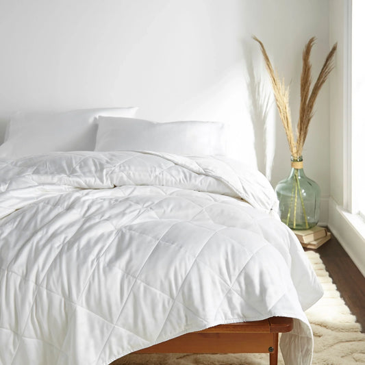 White bamboo duvet comforter shown styled on a neatly made queen bed