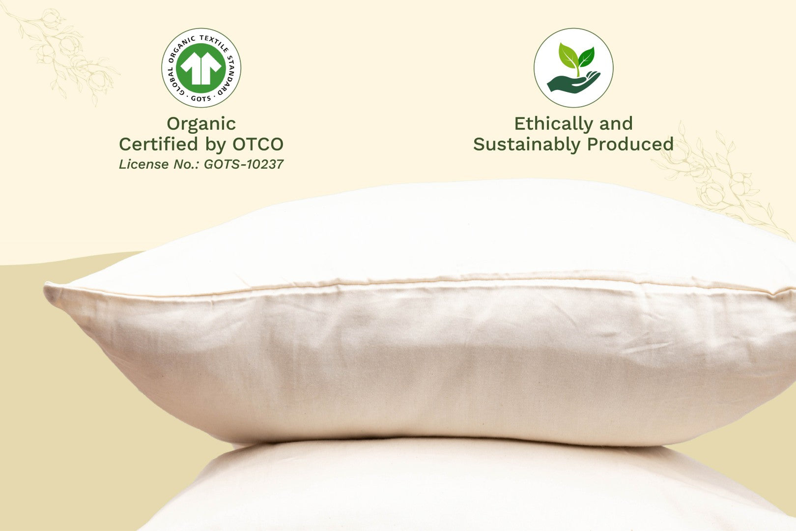 Organic sateen pillowcases in ivory cream displayed beside matching folded sheets