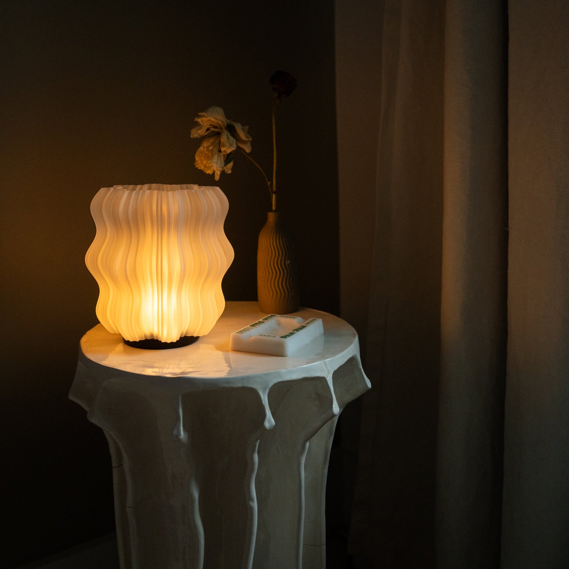 Mini Wavy Lamp on dining table set with plates and glassware