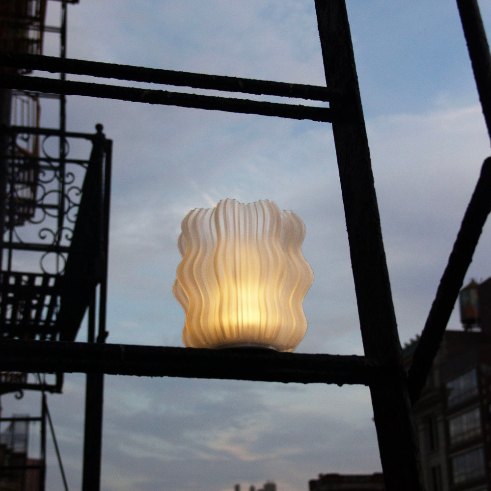 Mini Wavy Lamp lit on bathroom counter showing warm bedside-style glow
