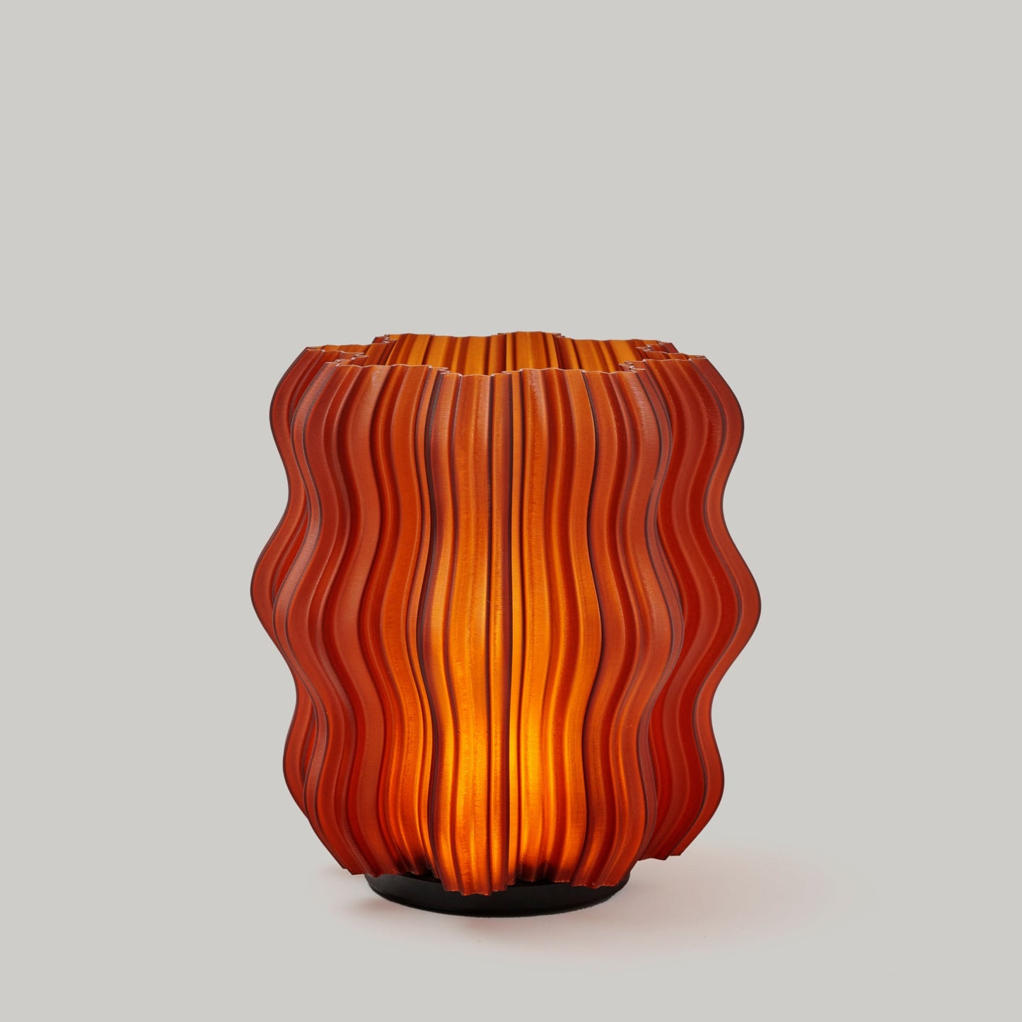 Cordless Mini Wavy Lamp in matte black on plain studio background