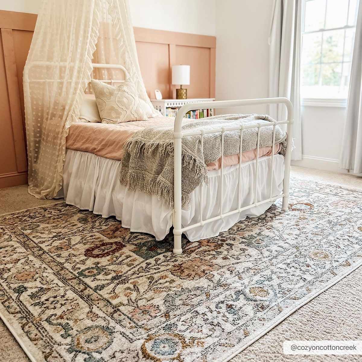 Herstmonceux rug placed at entryway beneath bench and decor