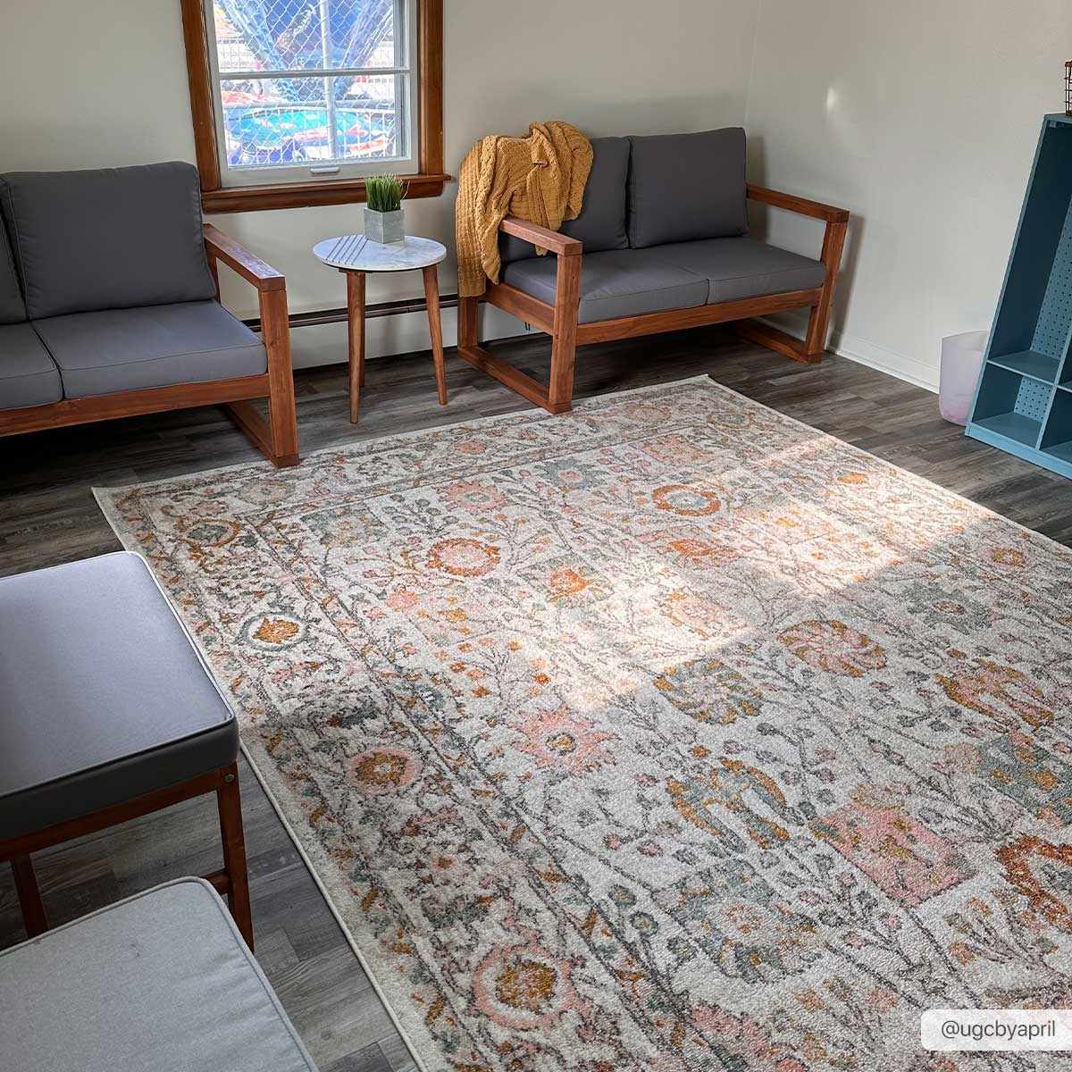 Herstmonceux rug styled in living room beneath sofa and coffee table