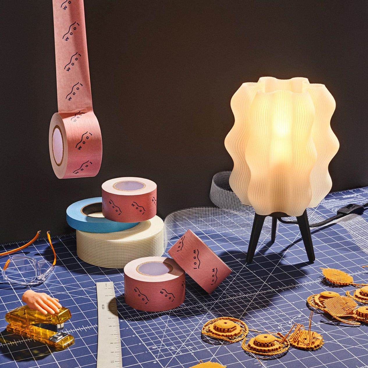 Wavy Lamp in lifestyle photo on wood desk near window