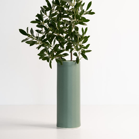 White porcelain Bloom Vase shown on plain background with curved silhouette