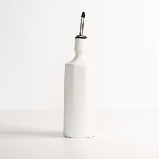 White porcelain Elixir olive oil dispenser shown against clean studio background