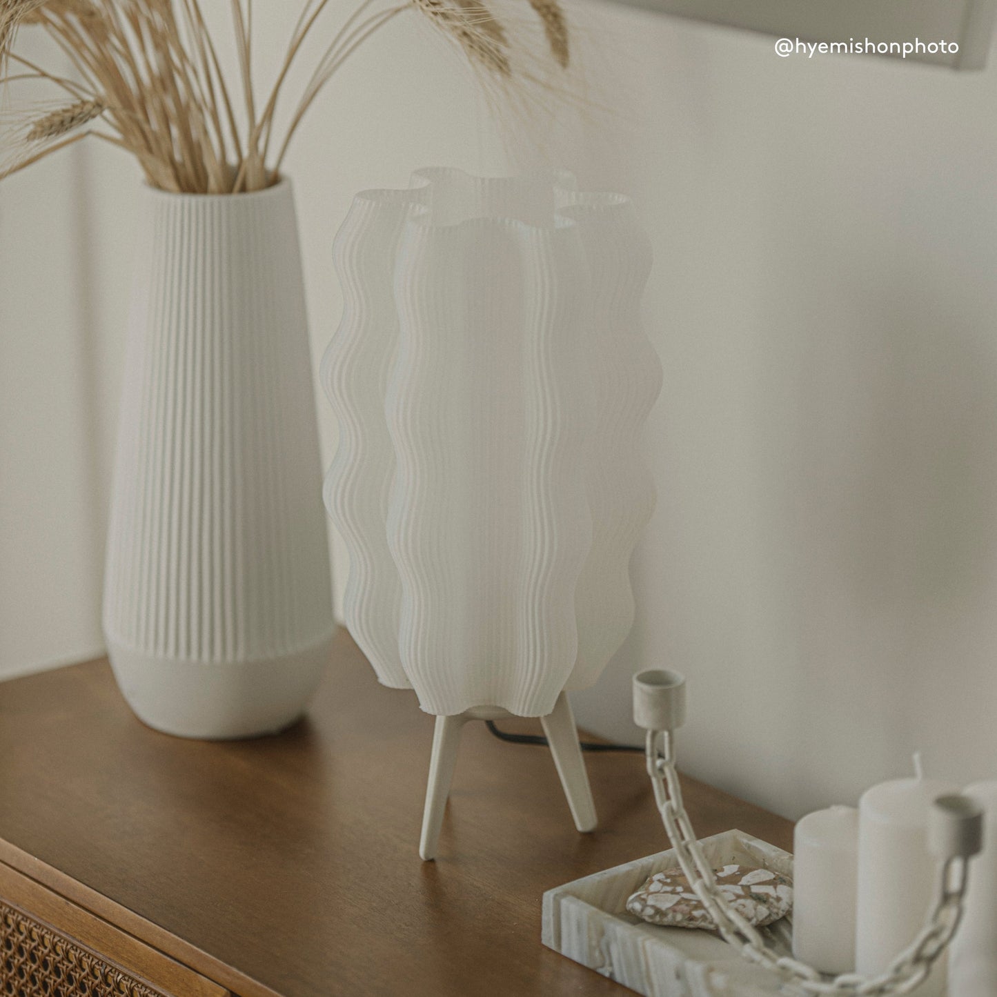 Customer photo of Wavy Lamp glowing in warm modern living room