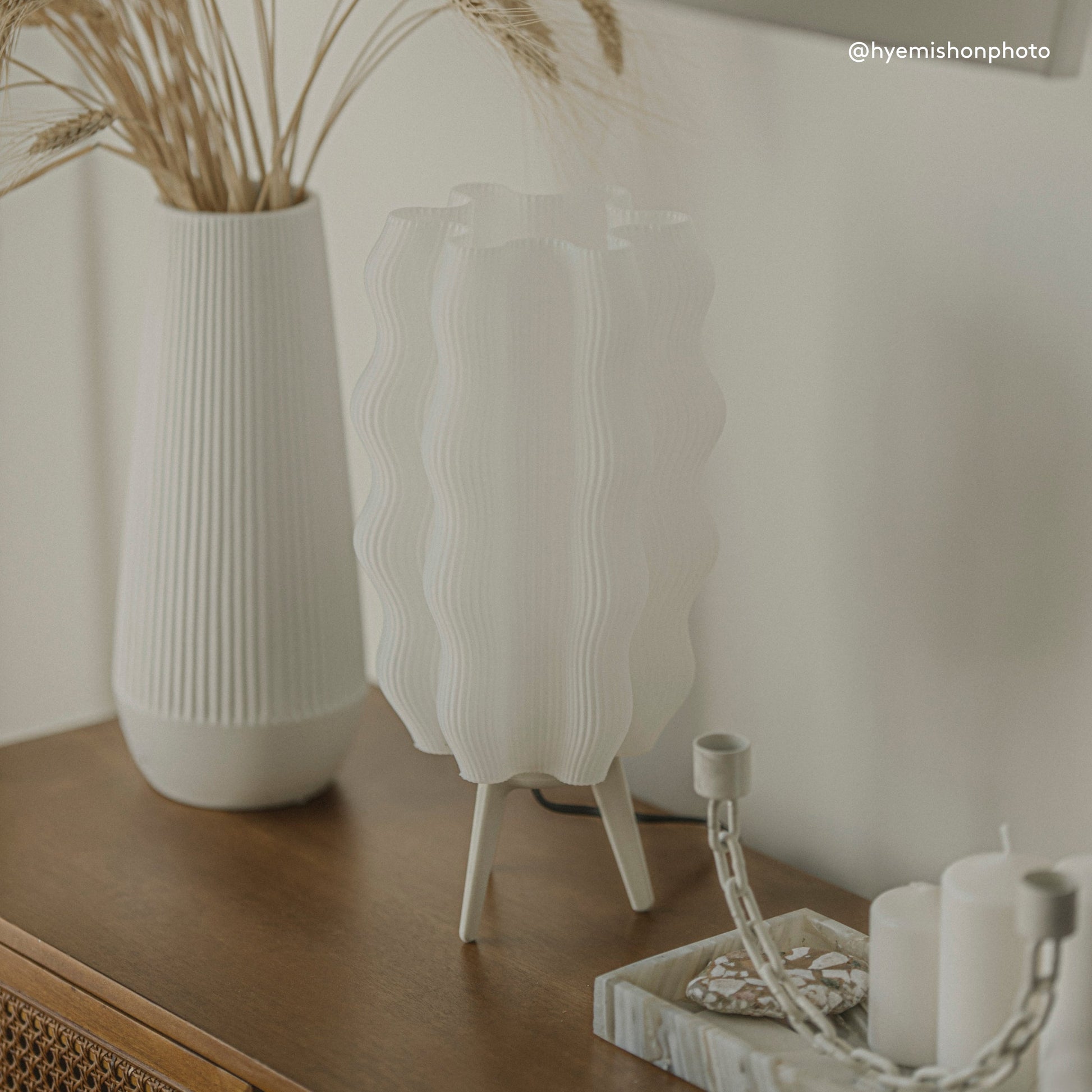Customer photo of Wavy Lamp glowing in warm modern living room