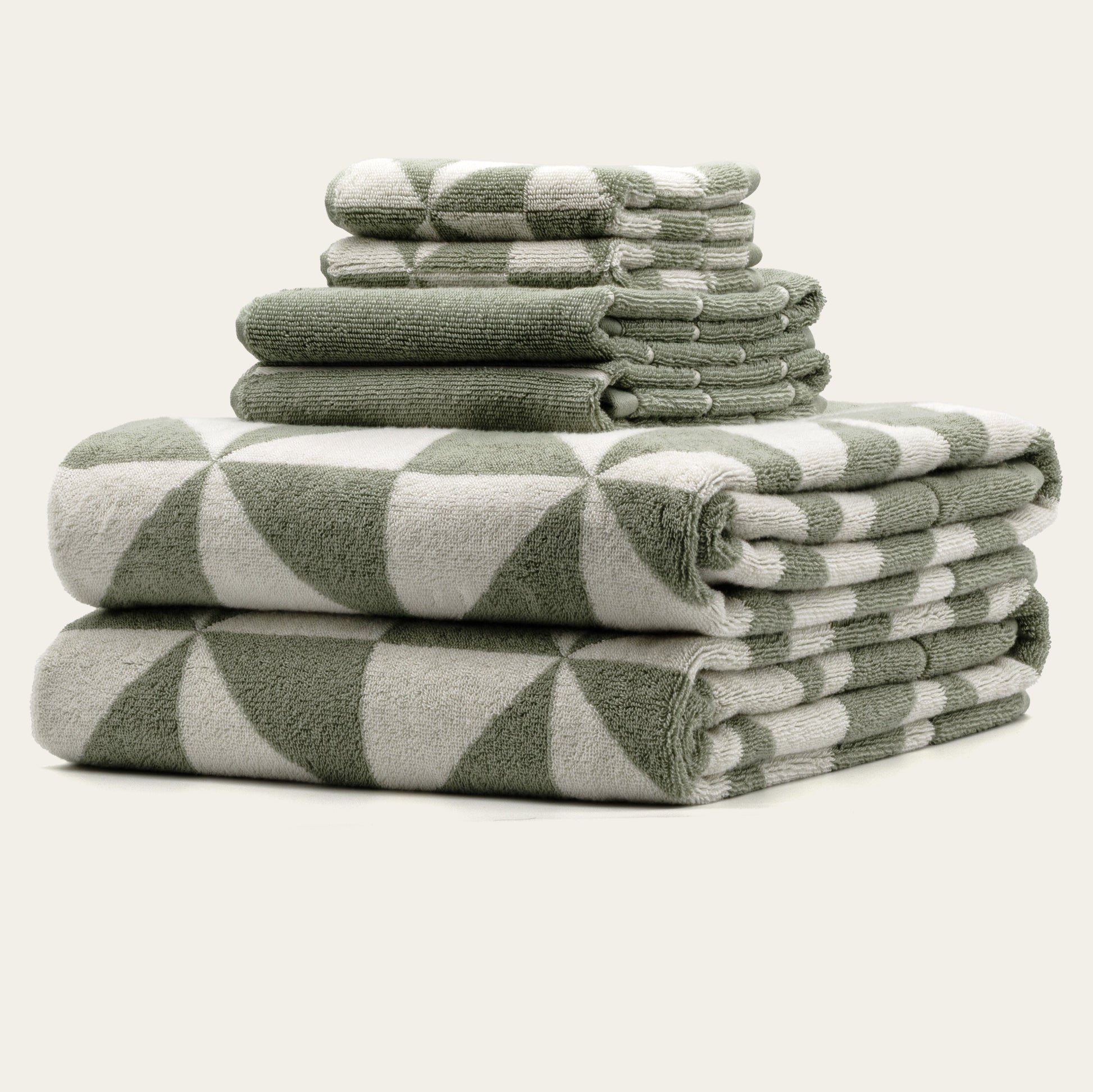 Umbra luxe set towels stacked in coordinated cream and tan colors