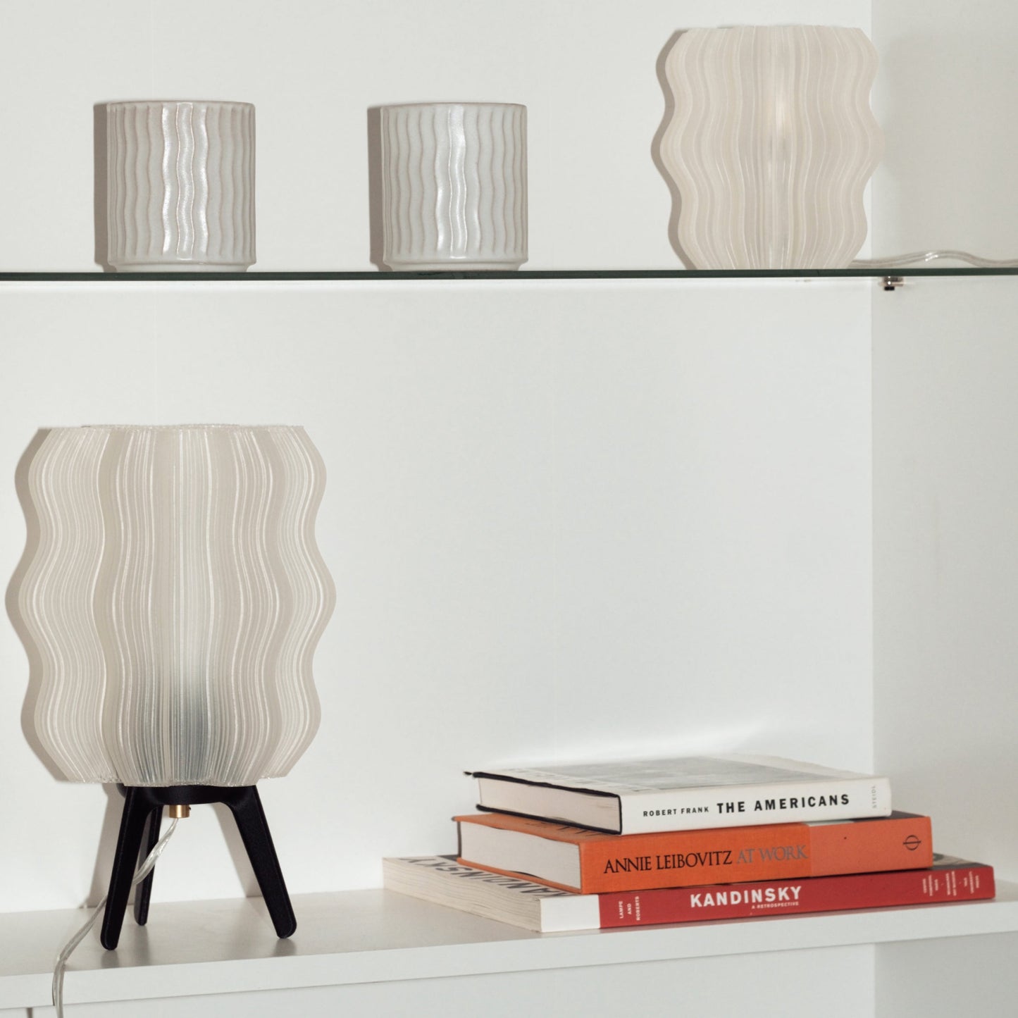 Wavy Lamp styled on console table with decorative accent pieces