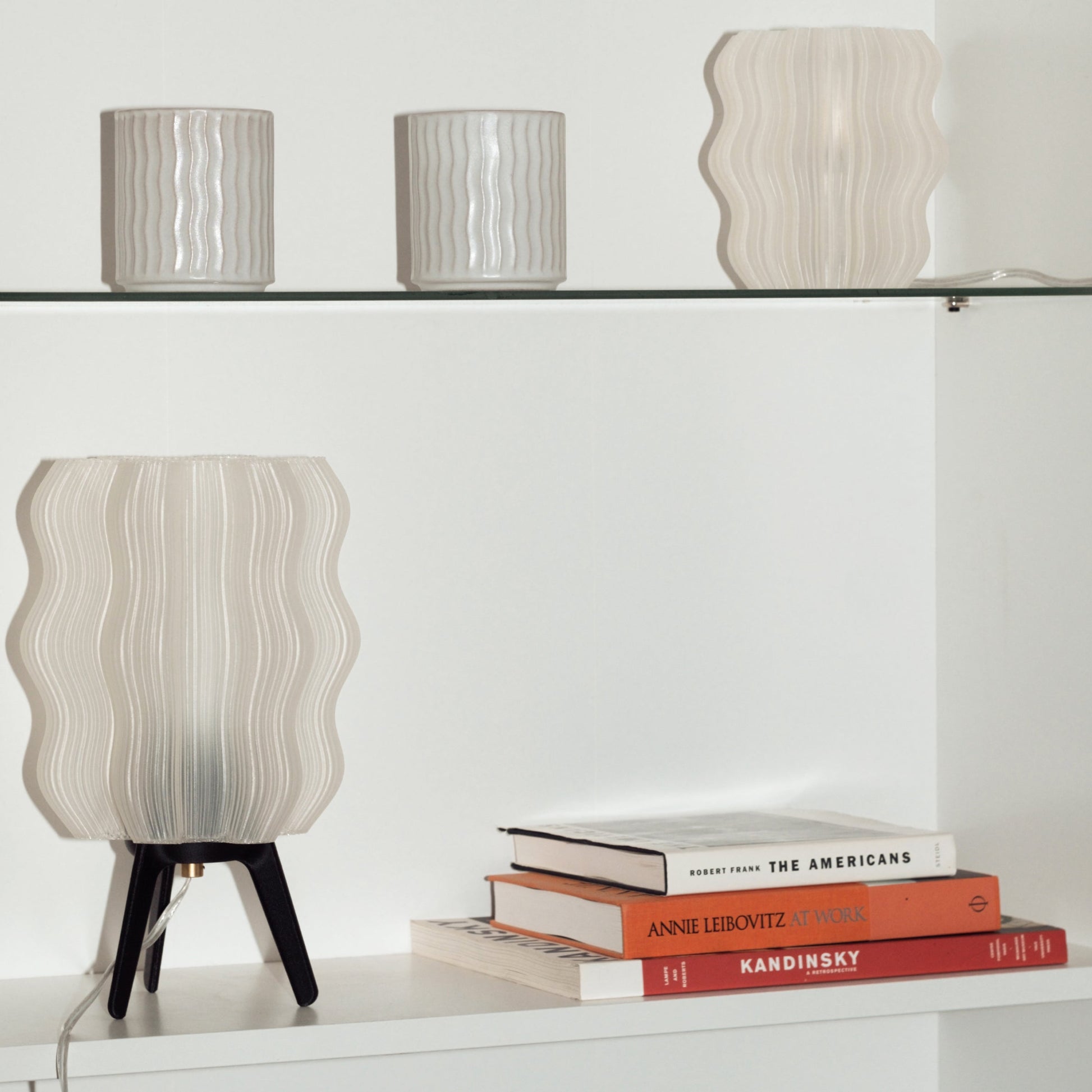 Wavy Lamp styled on console table with decorative accent pieces