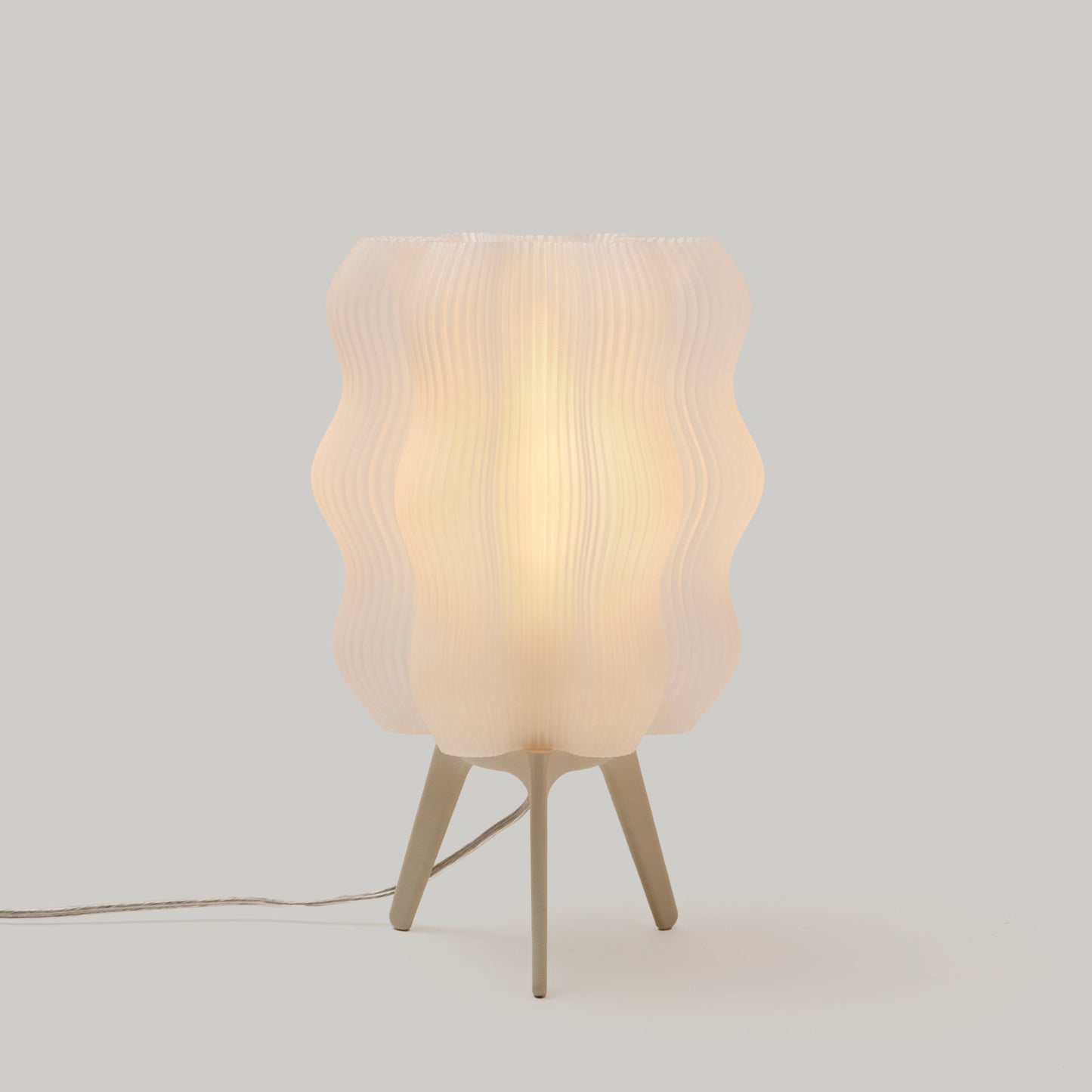Eggshell color standard Wavy Lamp on plain studio background