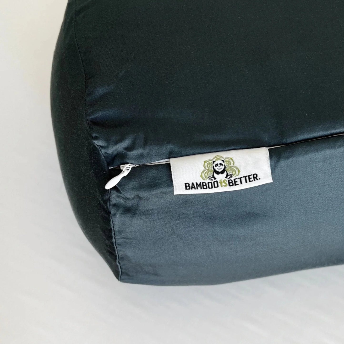 Hand touching bamboo pillowcase to demonstrate silky cool hand feel