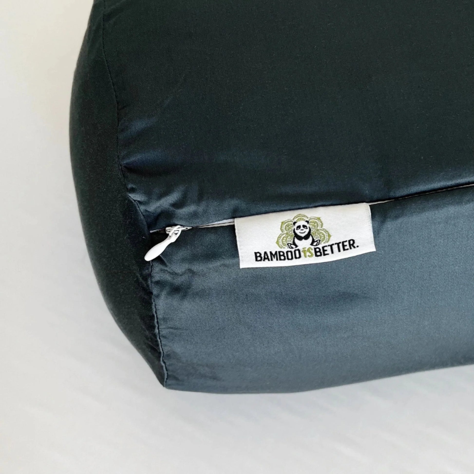 Hand touching bamboo pillowcase to demonstrate silky cool hand feel