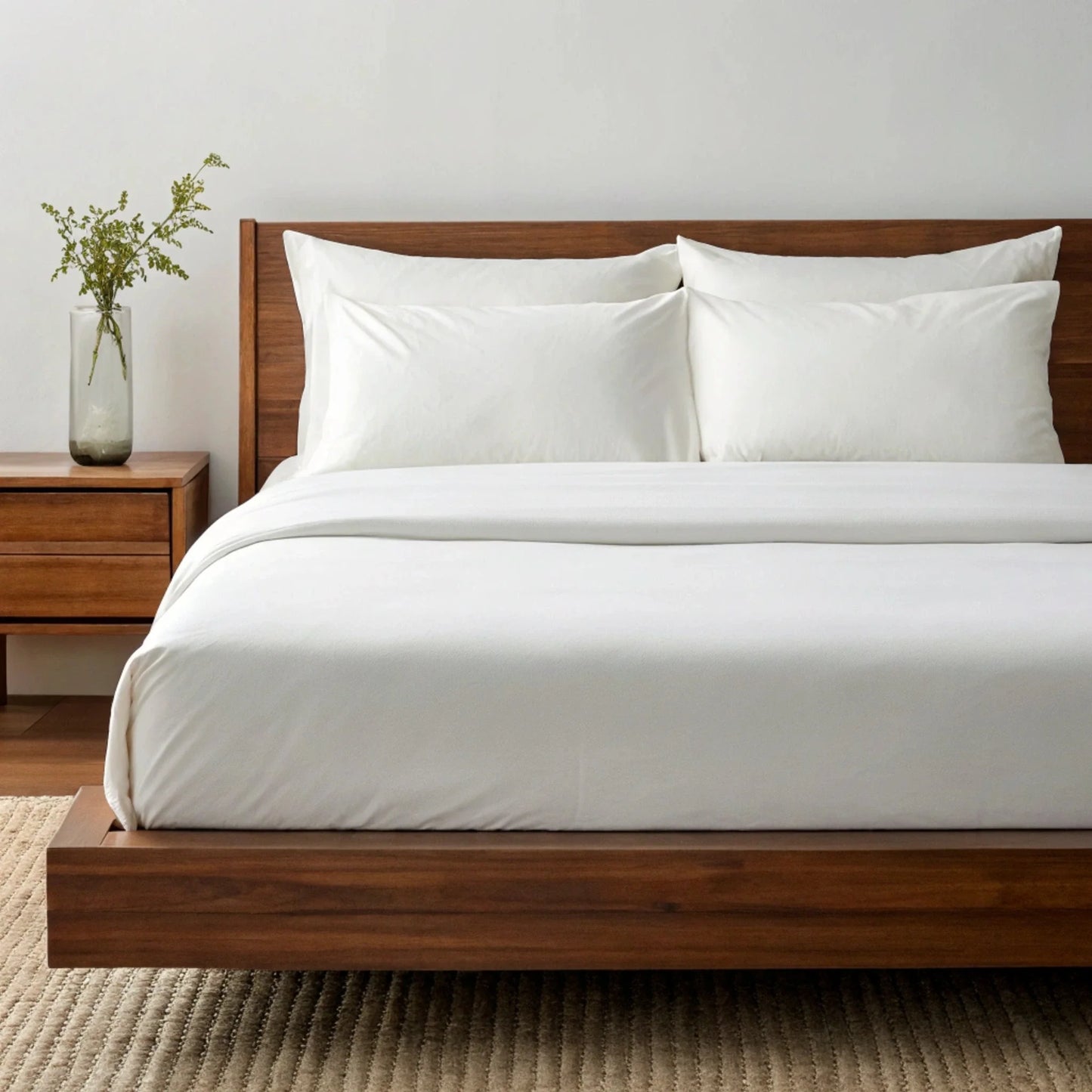 Bamboo sheet set styled bedroom scene with linen-look duvet and natural light