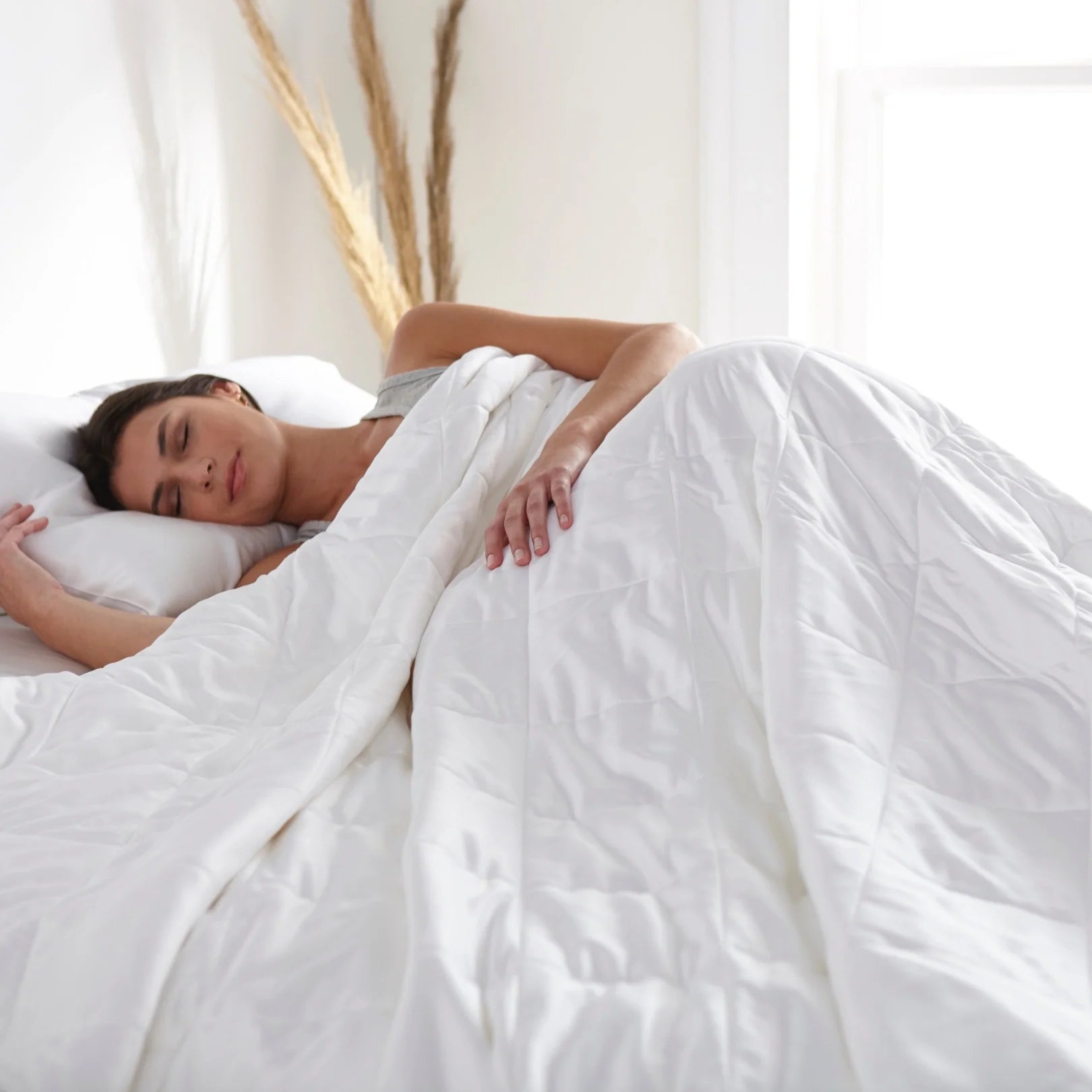 Bamboo duvet comforter draped over bed corner showing soft natural drape