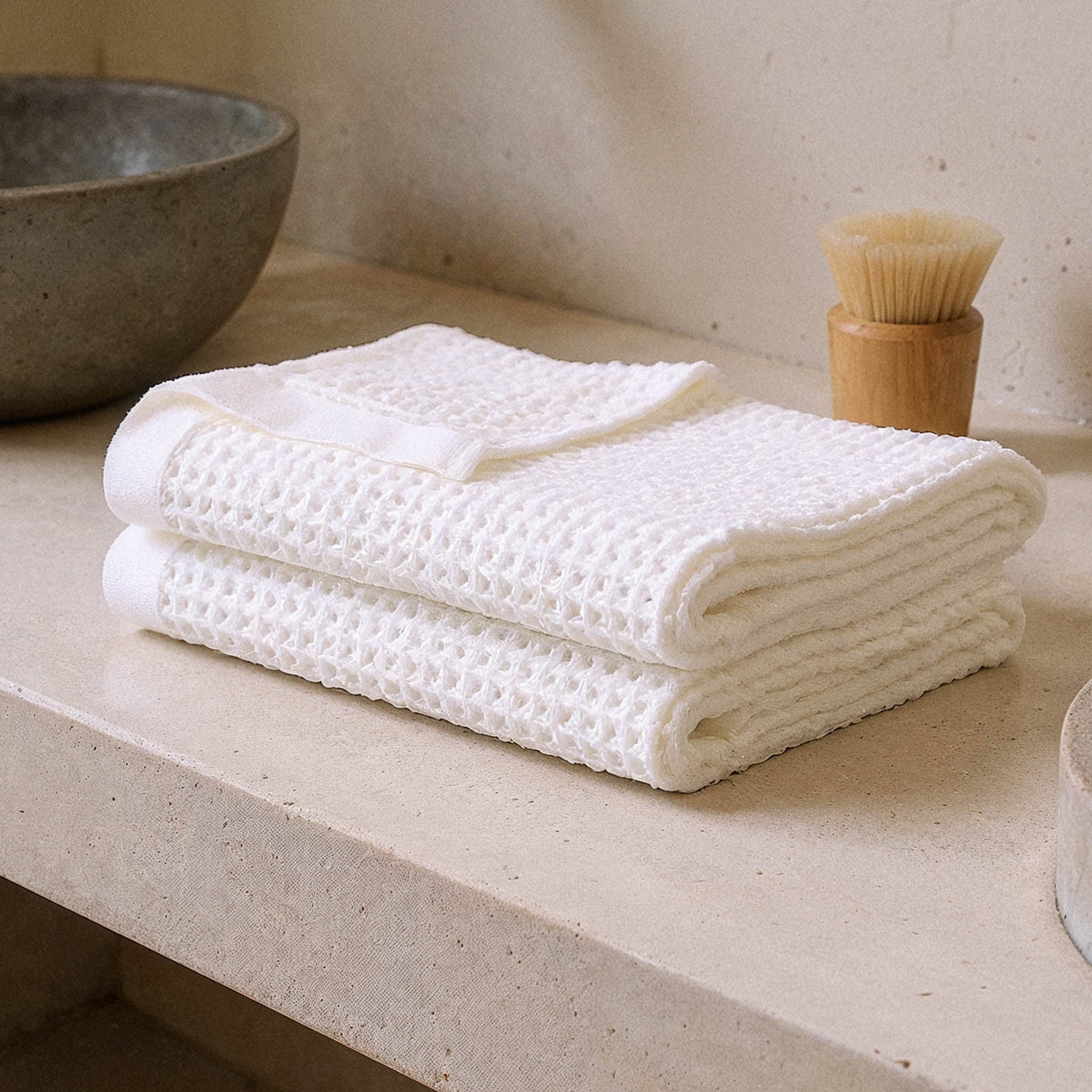 Sedona waffle towel styled with bath caddy in warm modern bathroom