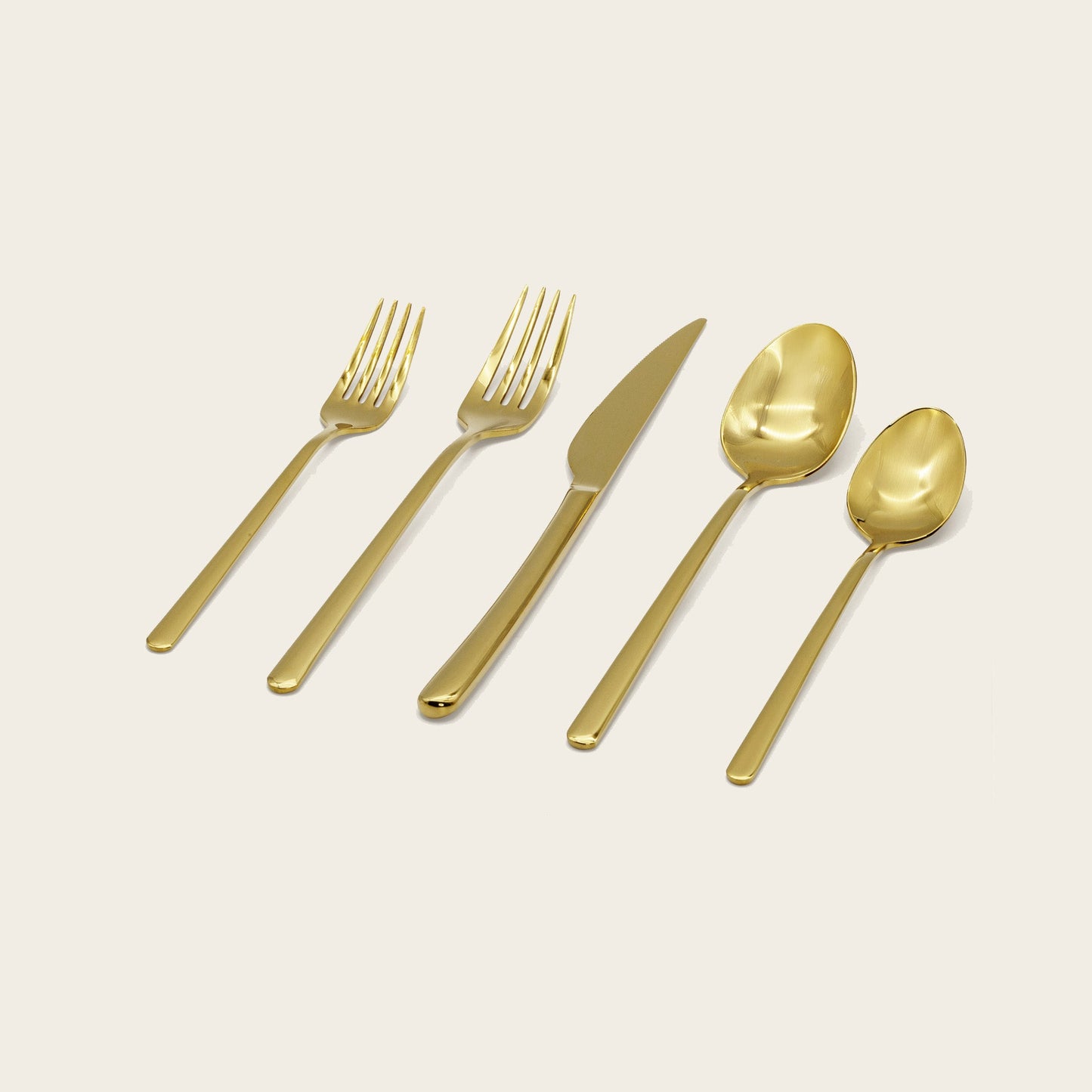 Single Emilia mirror polish dinner fork on plain studio background