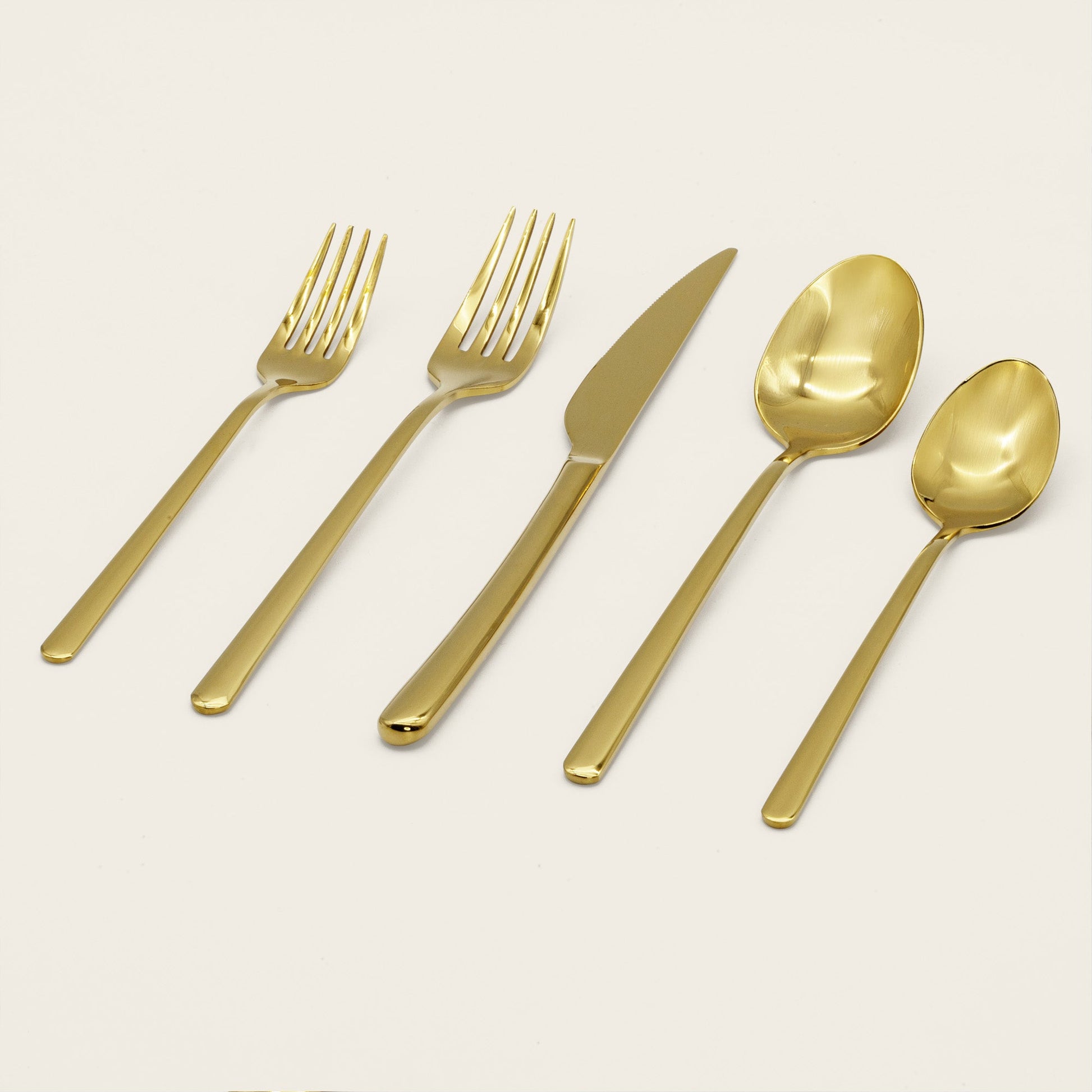 Single Emilia mirror polish dinner knife on plain studio background