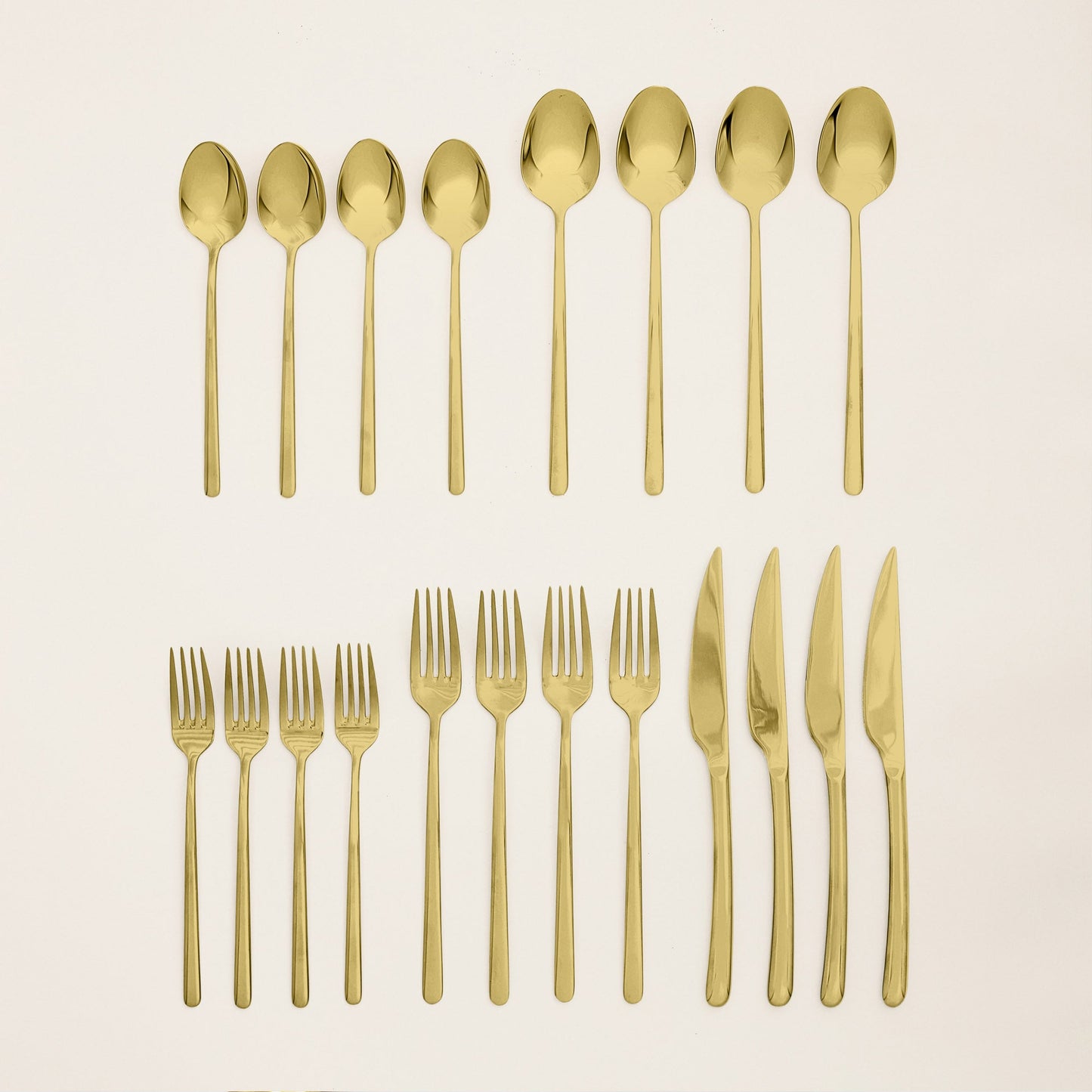Emilia flatware shown in hand to demonstrate scale and weight feel