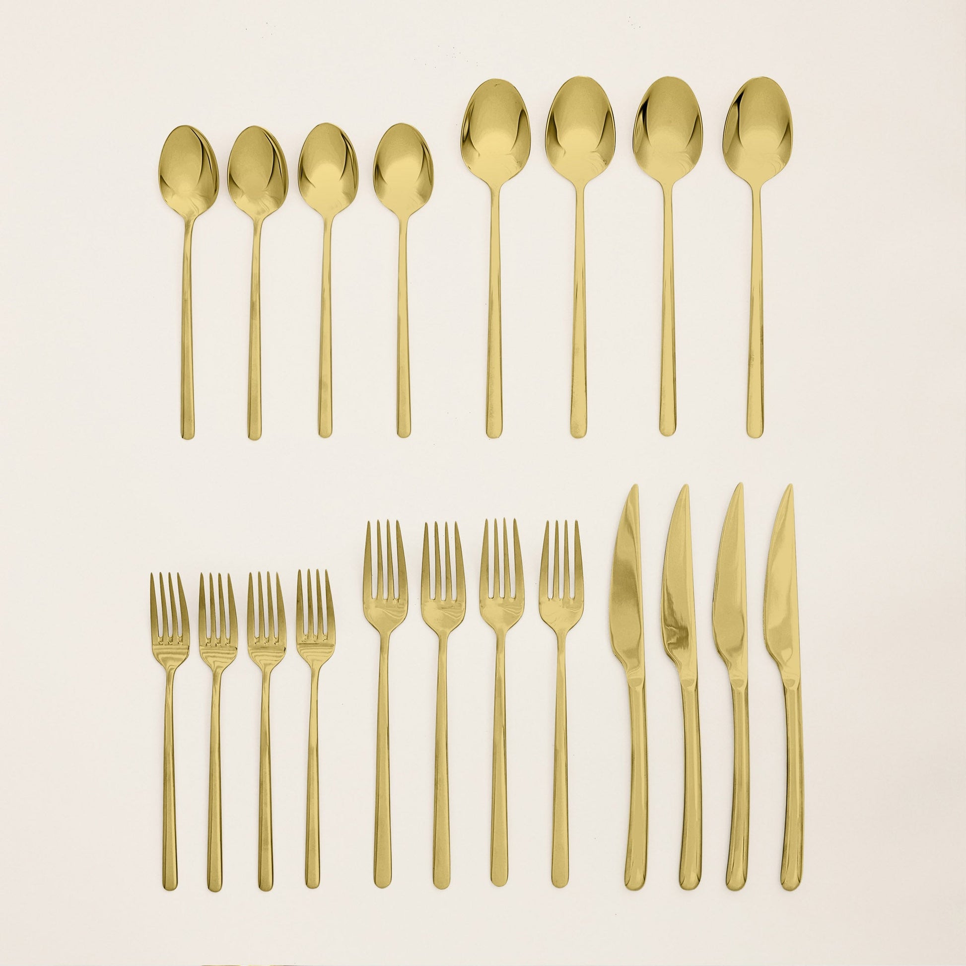 Emilia flatware shown in hand to demonstrate scale and weight feel