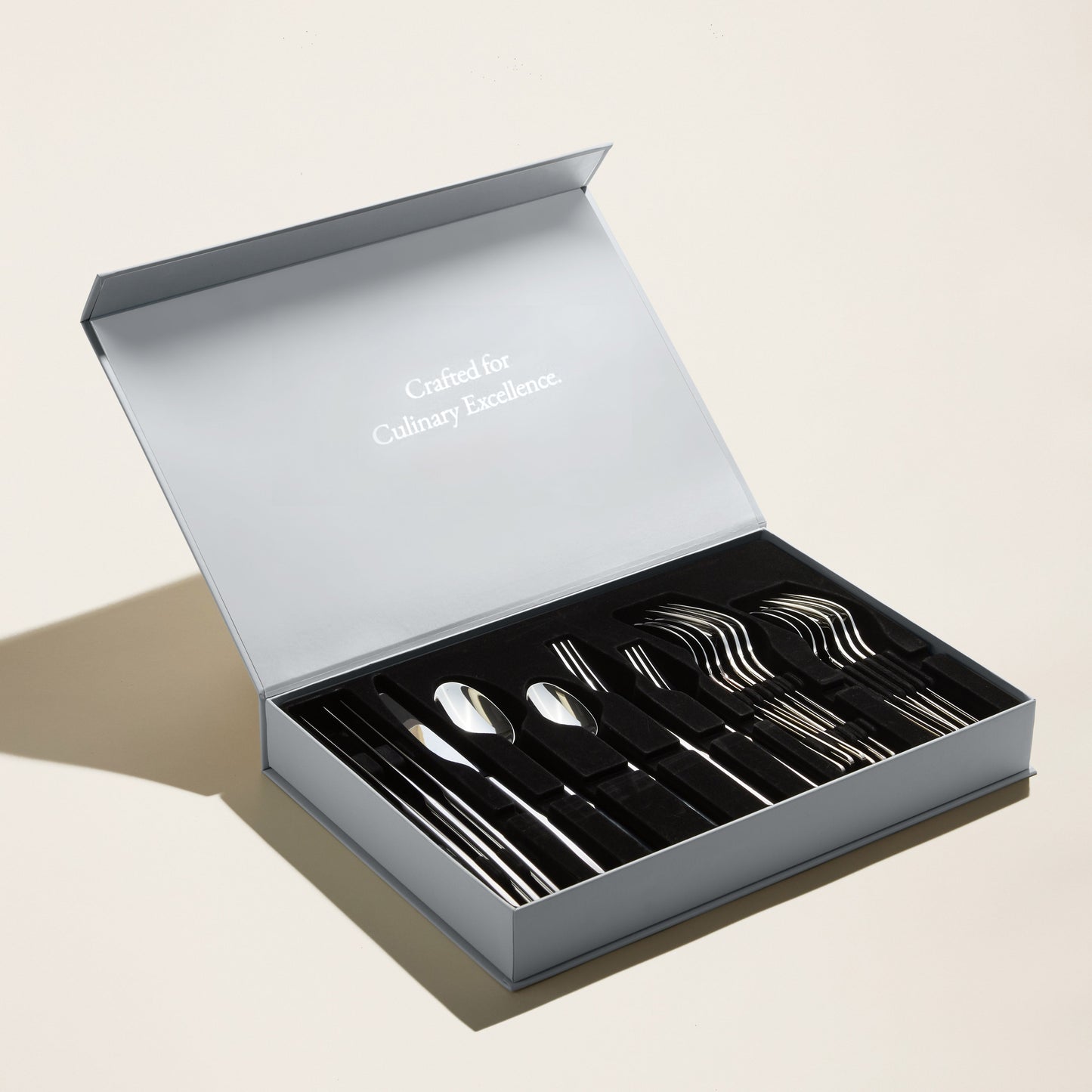 Emilia flatware styled on dining table during candlelit evening dinner