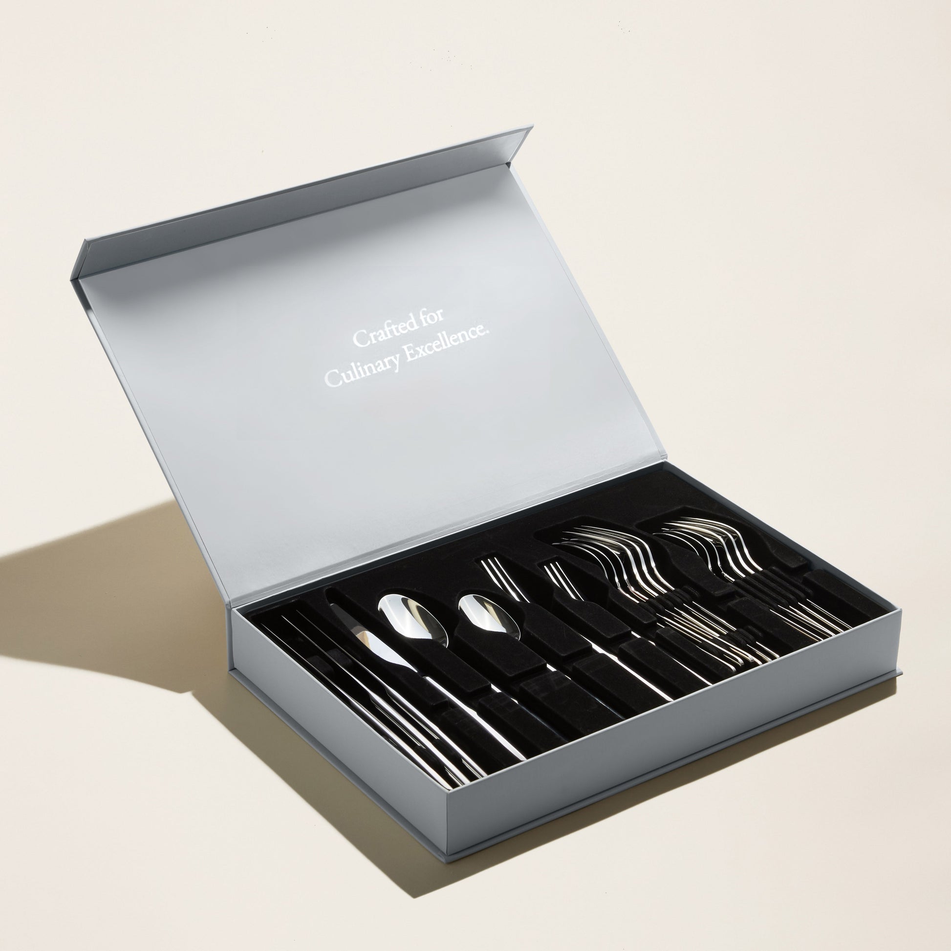 Emilia flatware styled on dining table during candlelit evening dinner