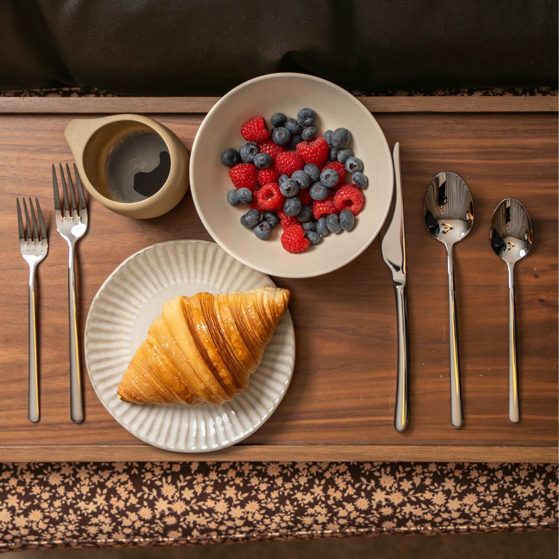 Emilia flatware set fanned showing forks knives spoons and teaspoons together