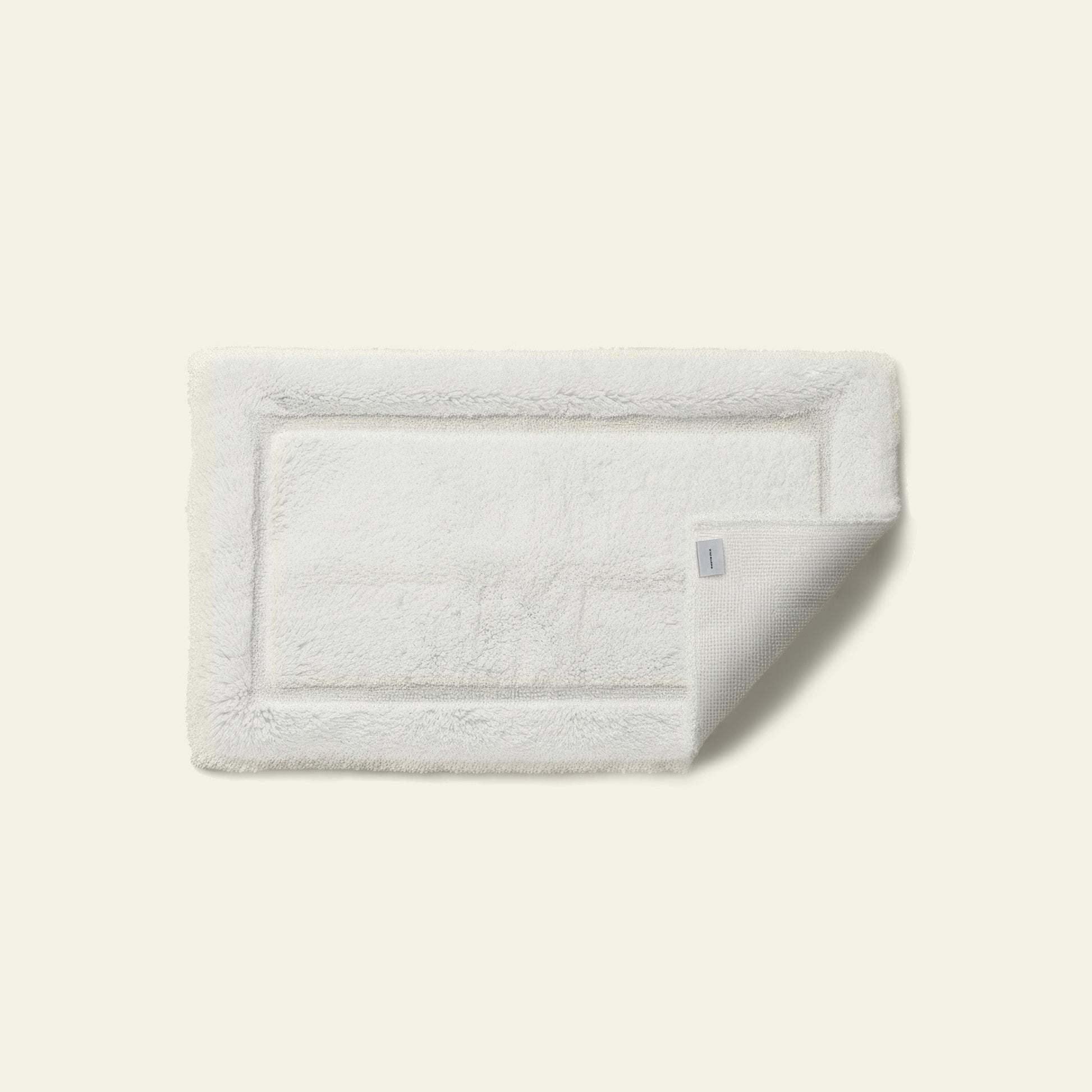 Ultraplush bath mat rolled showing soft pliable fabric construction quality