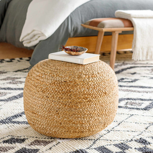 Kaumakani natural jute round pouf shown on plain studio background