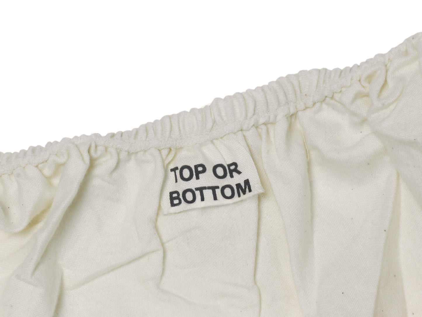 Organic sateen fitted sheet stretched over a mattress corner with deep pocket