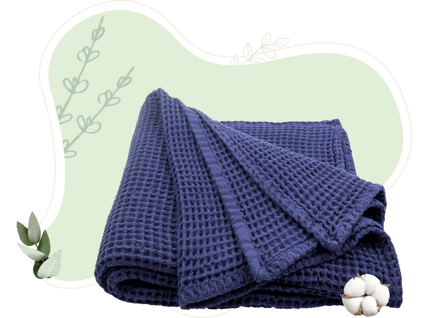 Waffle weave throw in soft gray folded neatly at the foot of bed