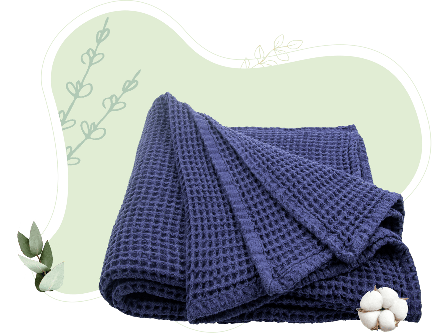 Waffle weave throw in soft gray folded neatly at the foot of bed