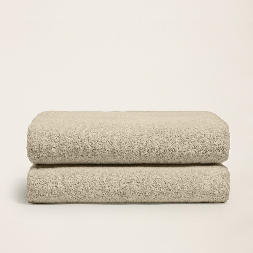 Ultraplush towel set folded in soft sand color tone closeup