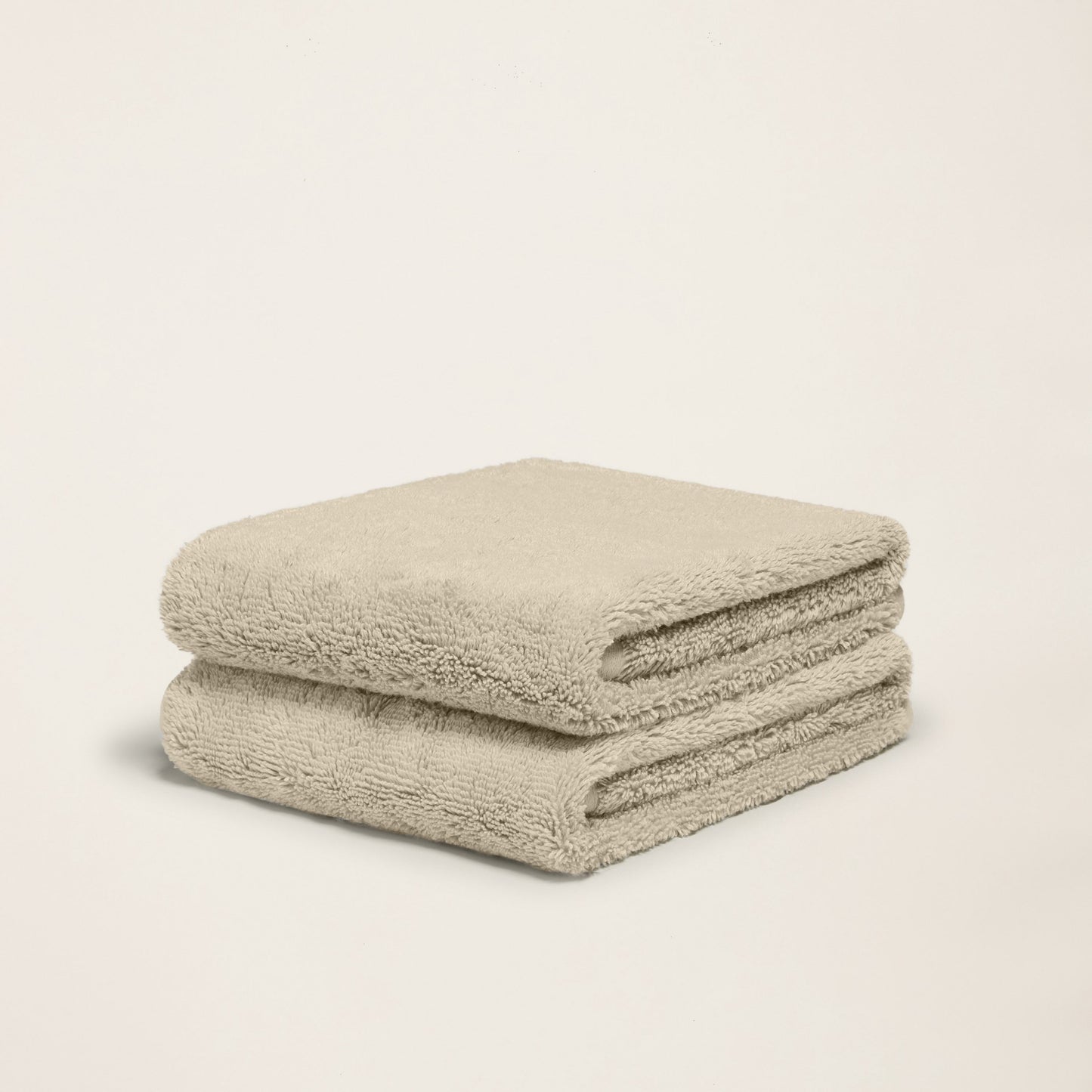 Ultraplush towel set folded in classic ivory color tone closeup