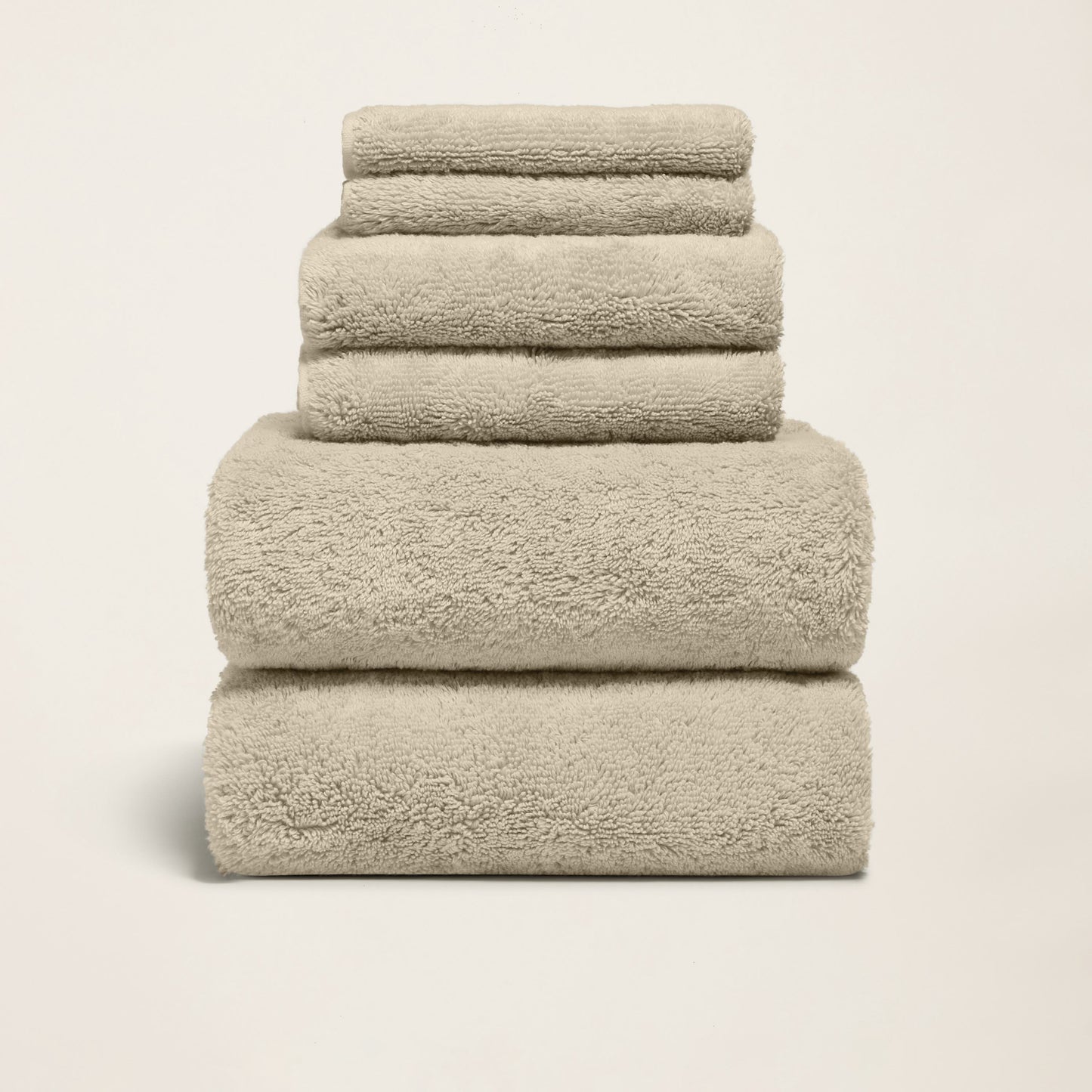 Ultraplush towels arranged in stack with folded labels and bands