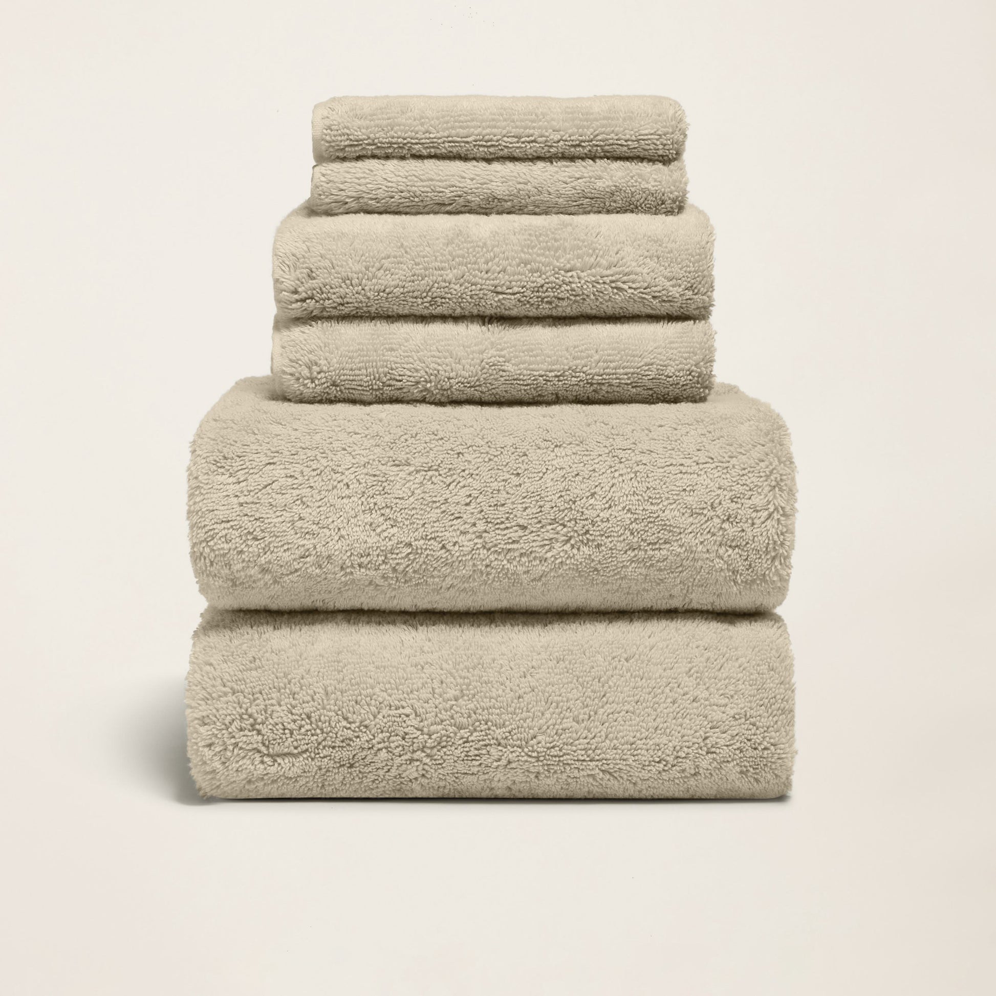 Ultraplush towels arranged in stack with folded labels and bands