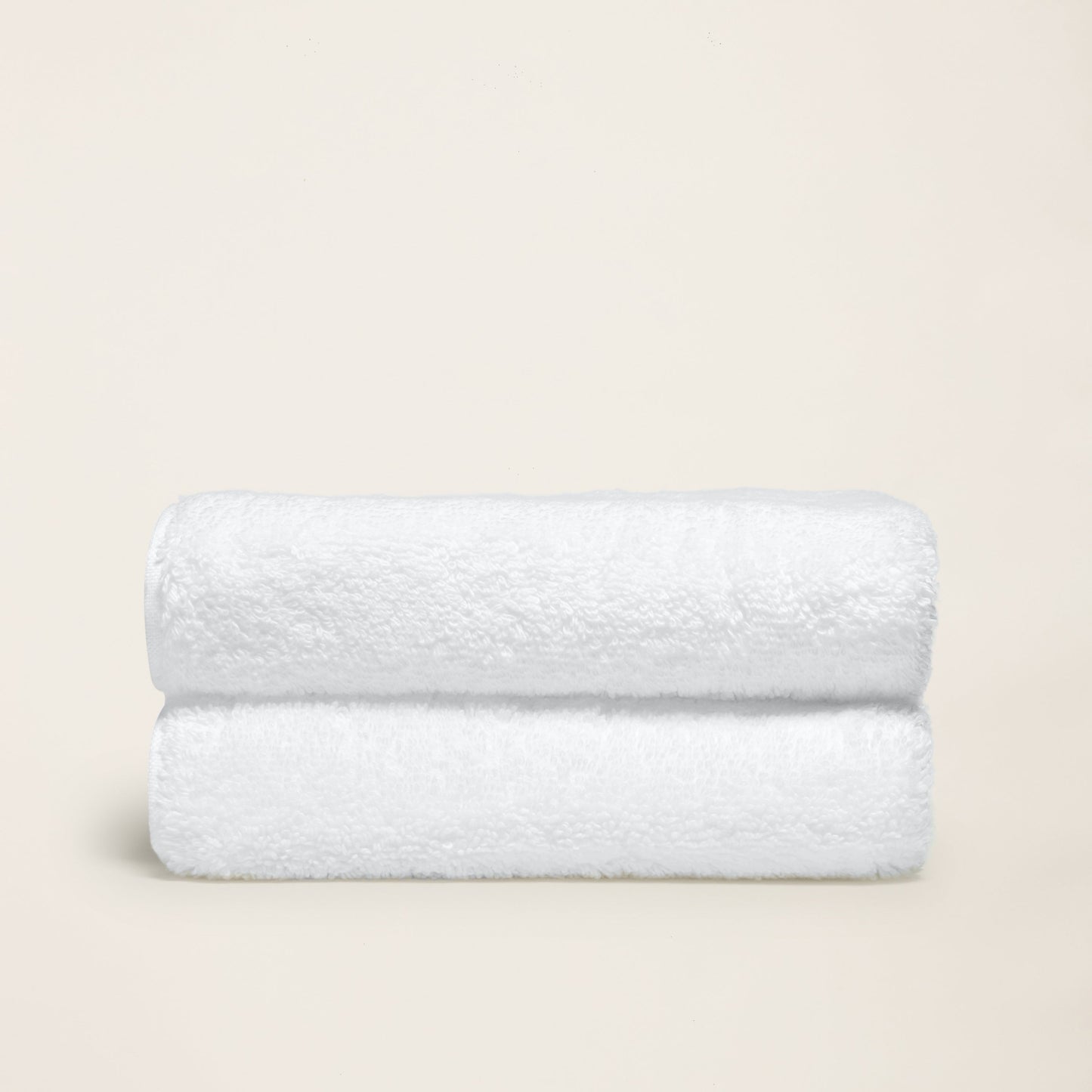 Ultraplush bath towel hung on rod beside walk-in shower interior