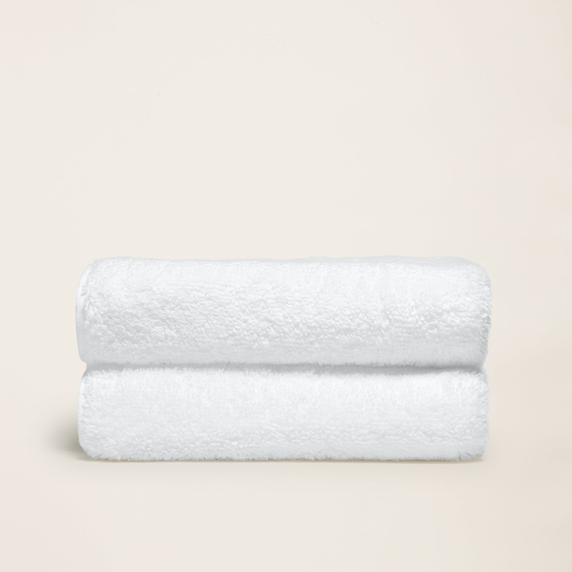 Ultraplush bath towel hung on rod beside walk-in shower interior
