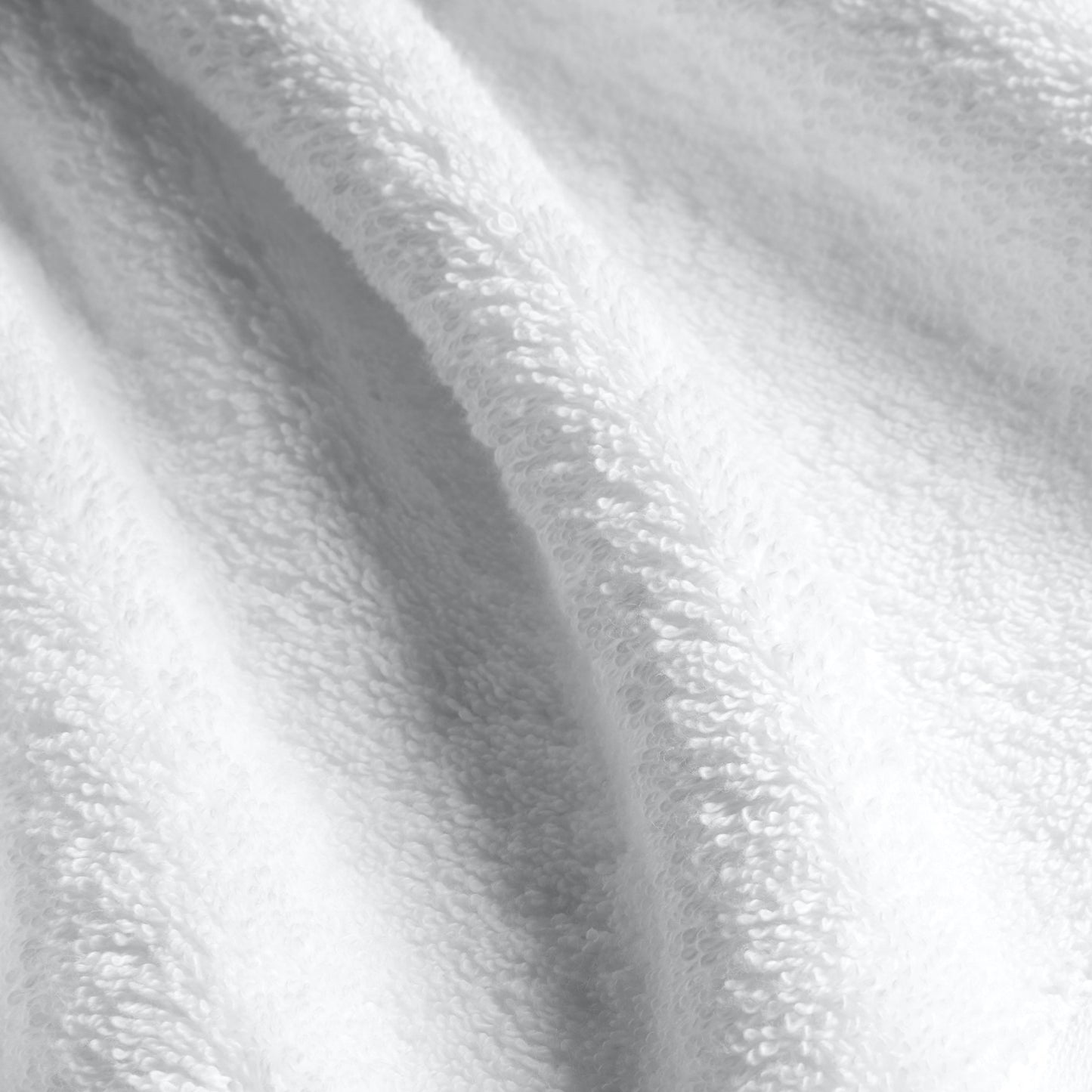 Ultraplush towel set styled in spa-inspired bathroom with greenery