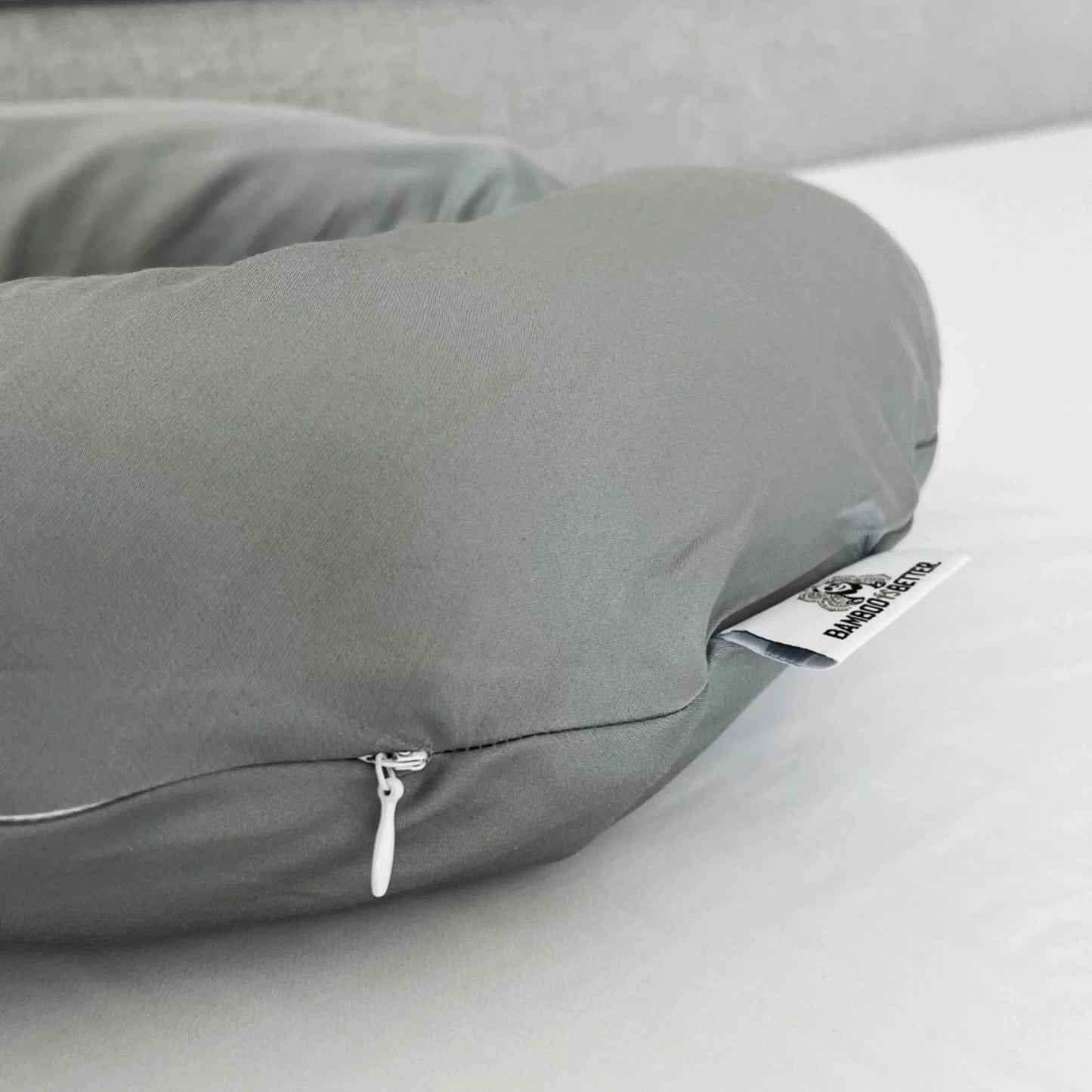 Bamboo pillowcase styled on bed with matching pillow inserted closeup